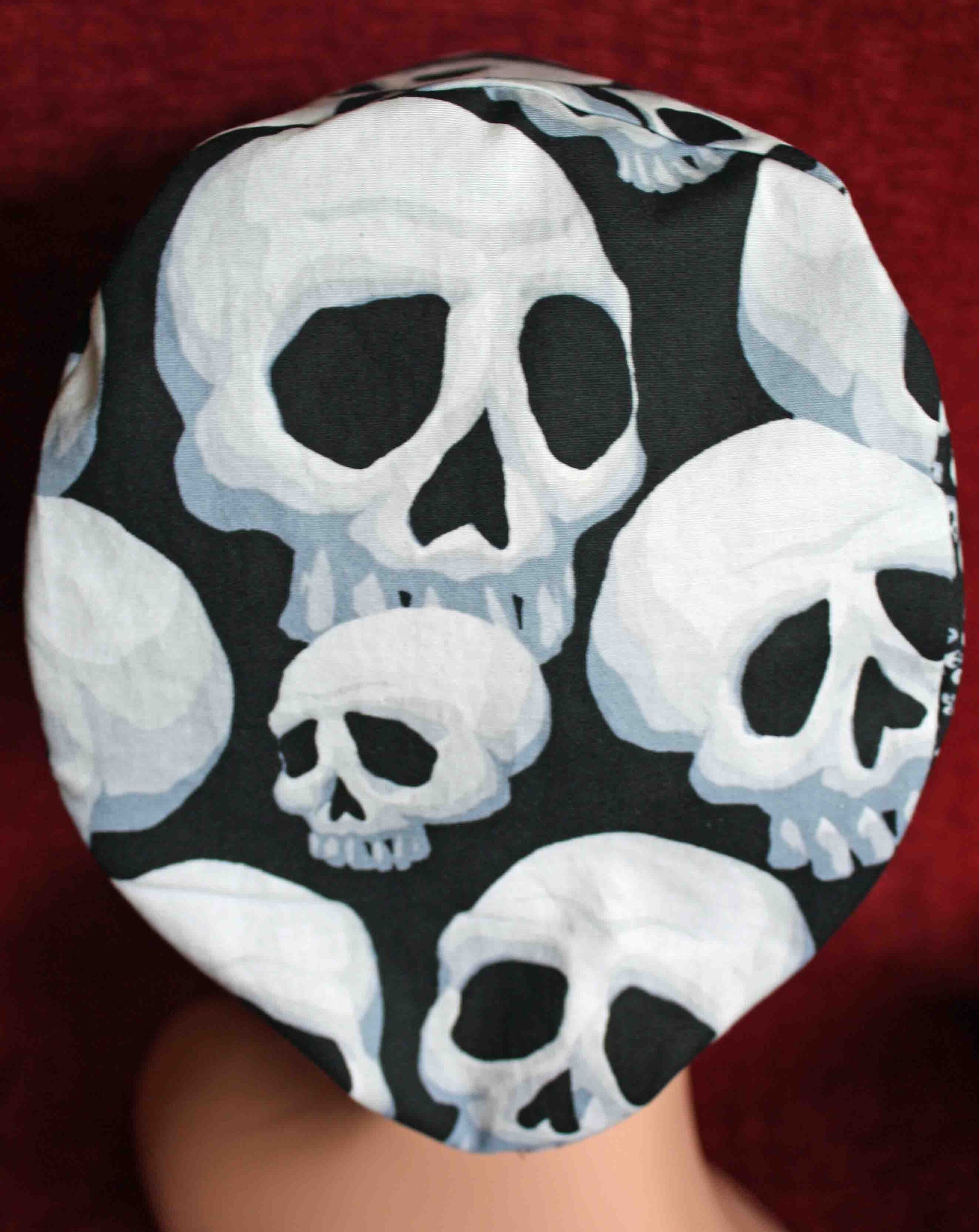 Handmade Black Fabric with White Varying Sized Skulls Surgical/Scrub Cap