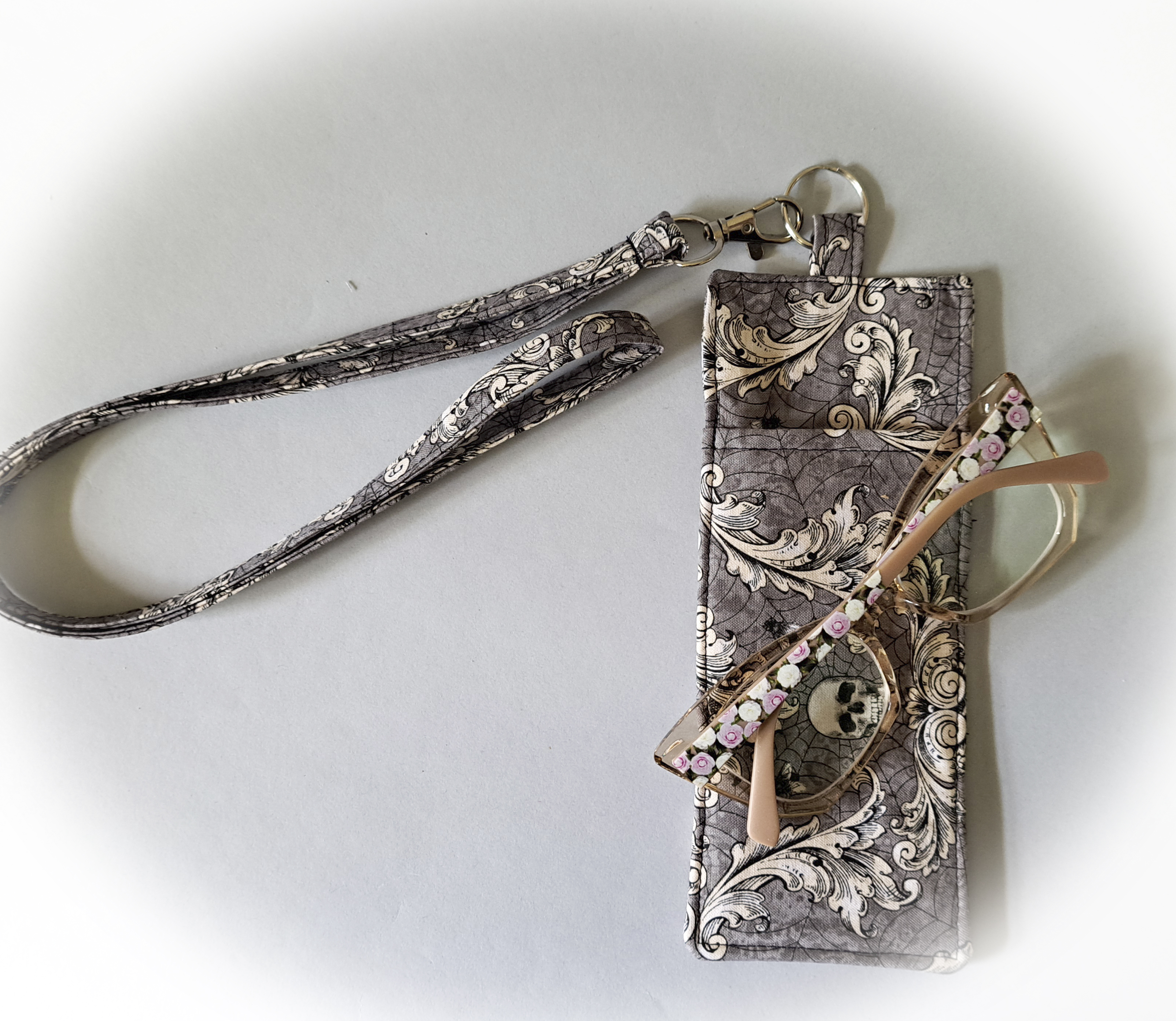 Skulls and Swirls Eyeglass and Pen Holder with Matching Lanyard