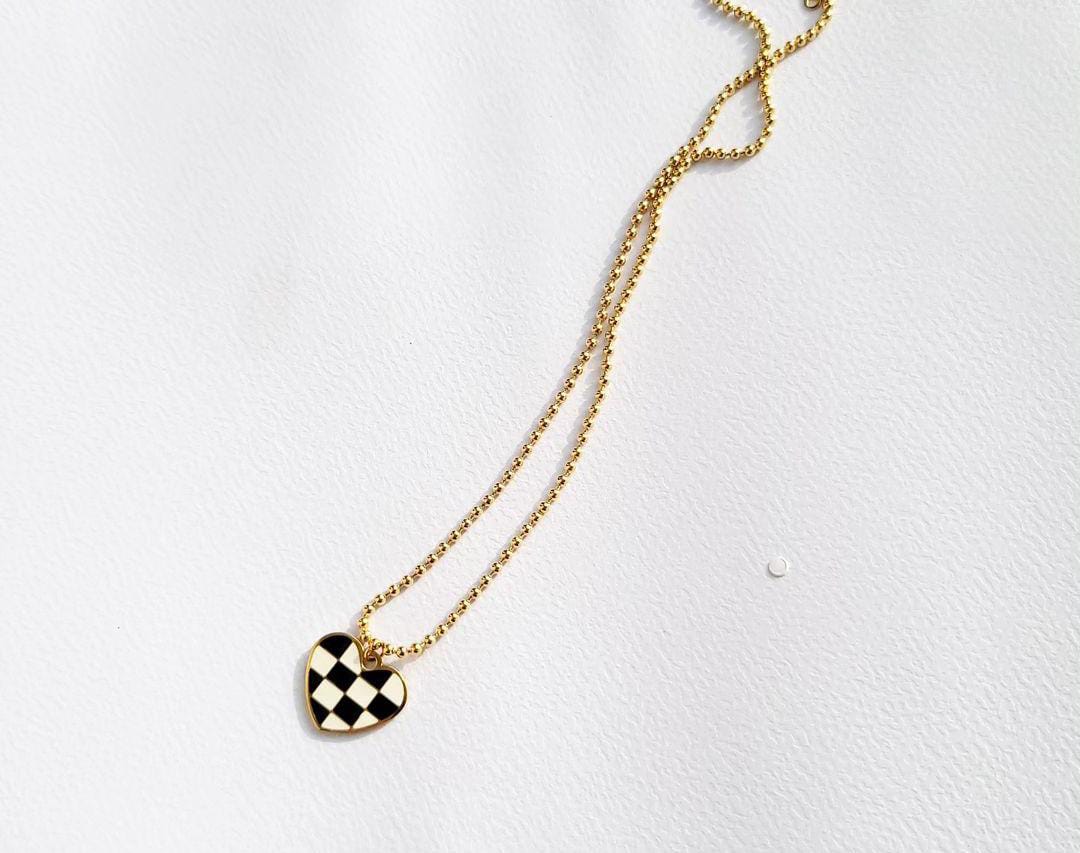 Checkered Charm: Black & White Patterned Pendant Necklace