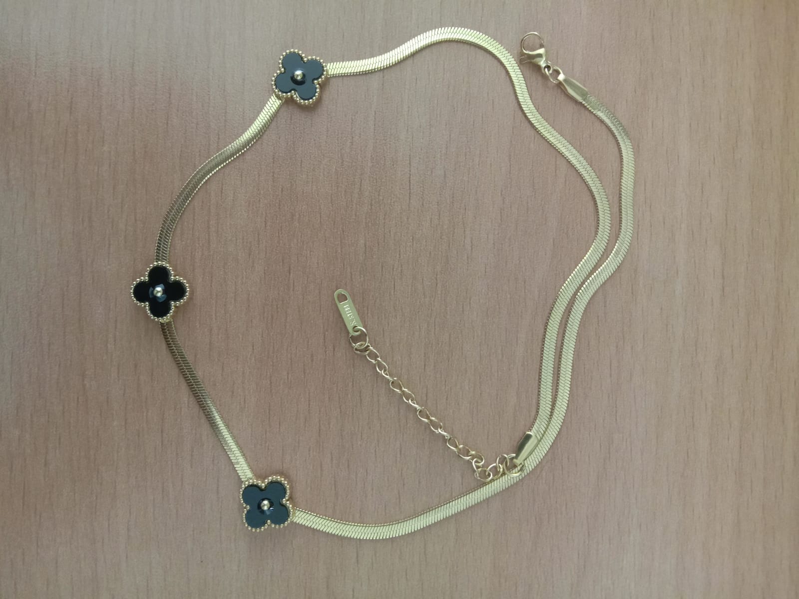 Elegant Gold-Tone Snake Chain Necklace with Black Flower Pendants