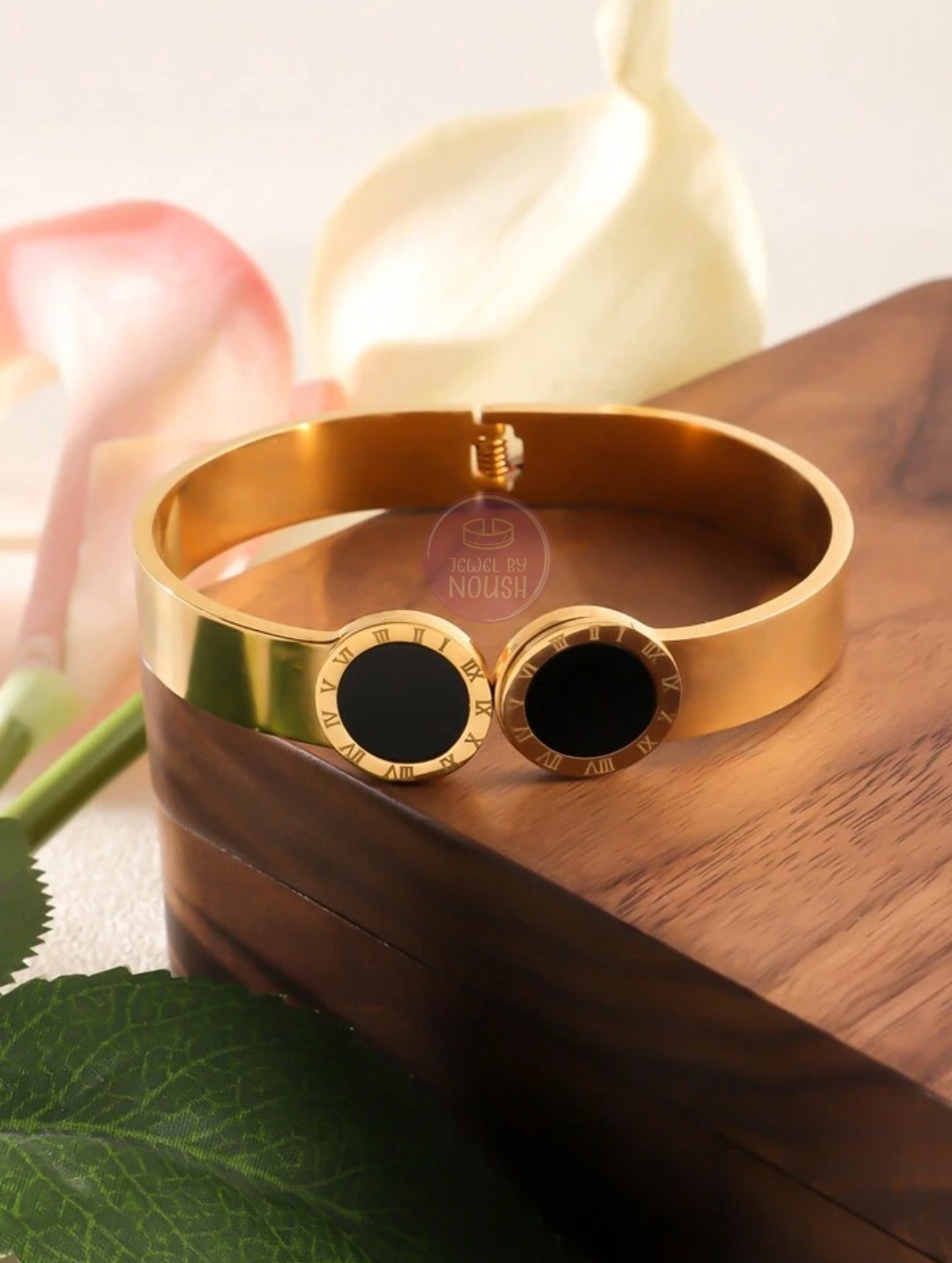 Elegant Gold Bracelet with Black Inlays