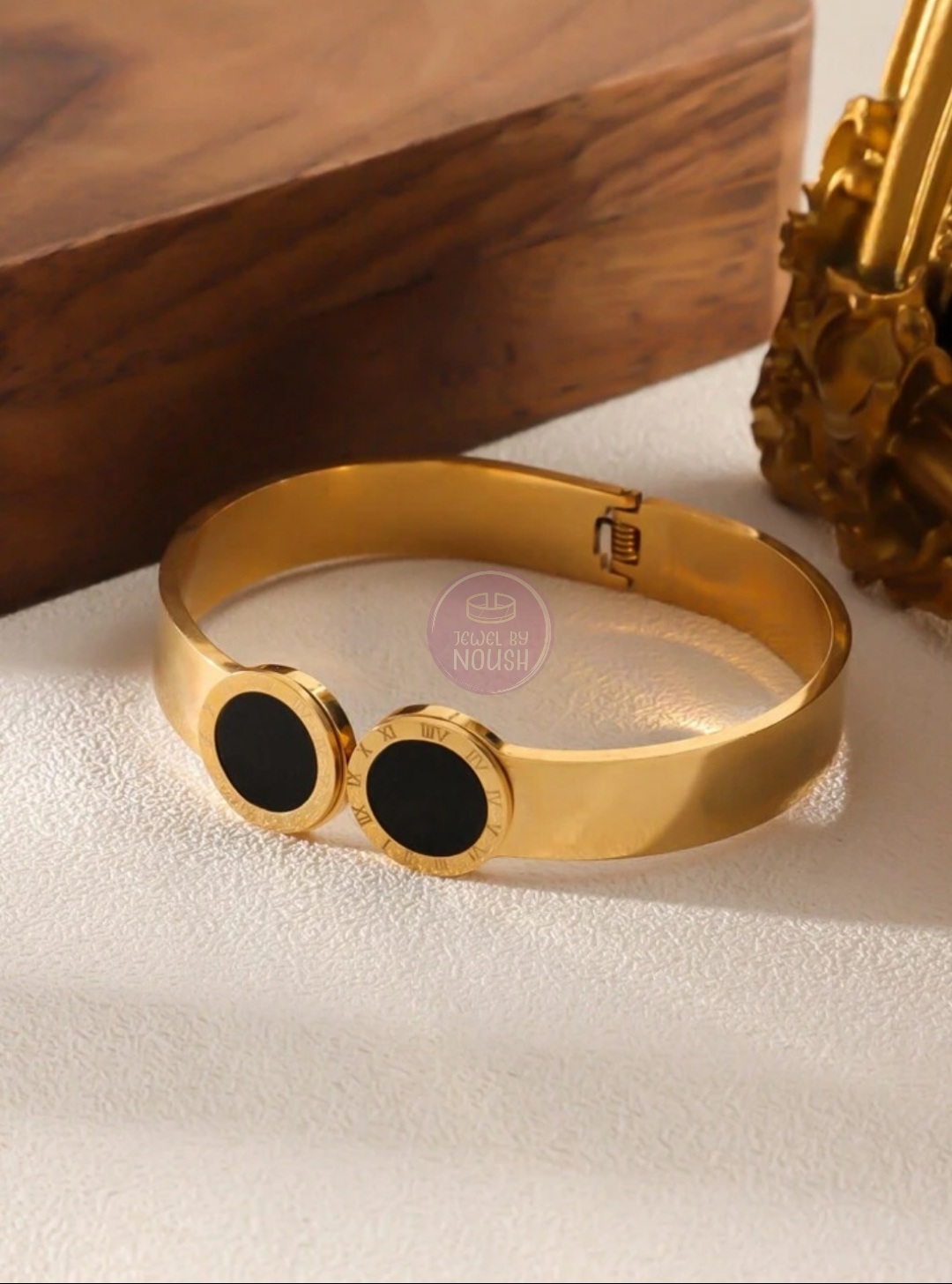 Elegant Gold Bracelet with Black Inlays
