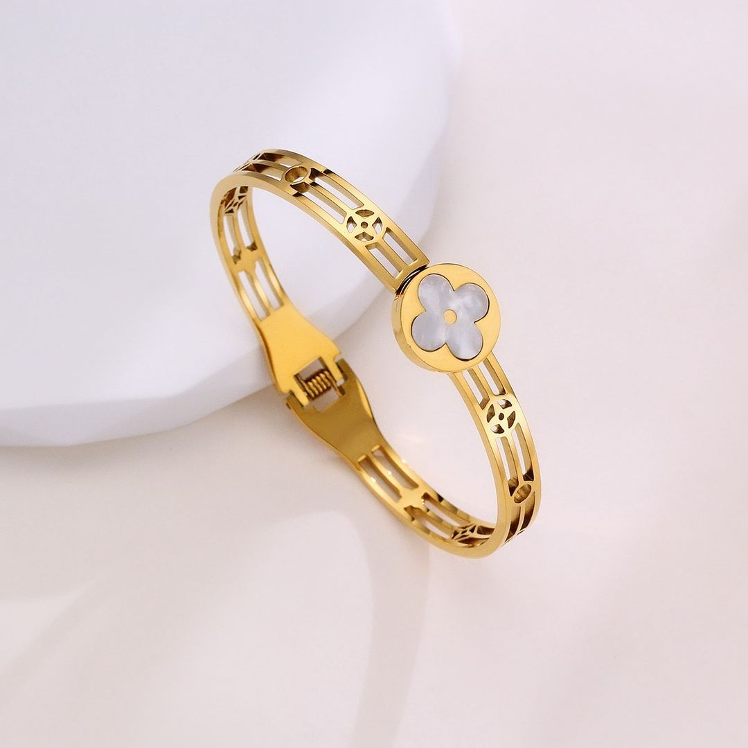 Gold Bracelet with White Flower Charm