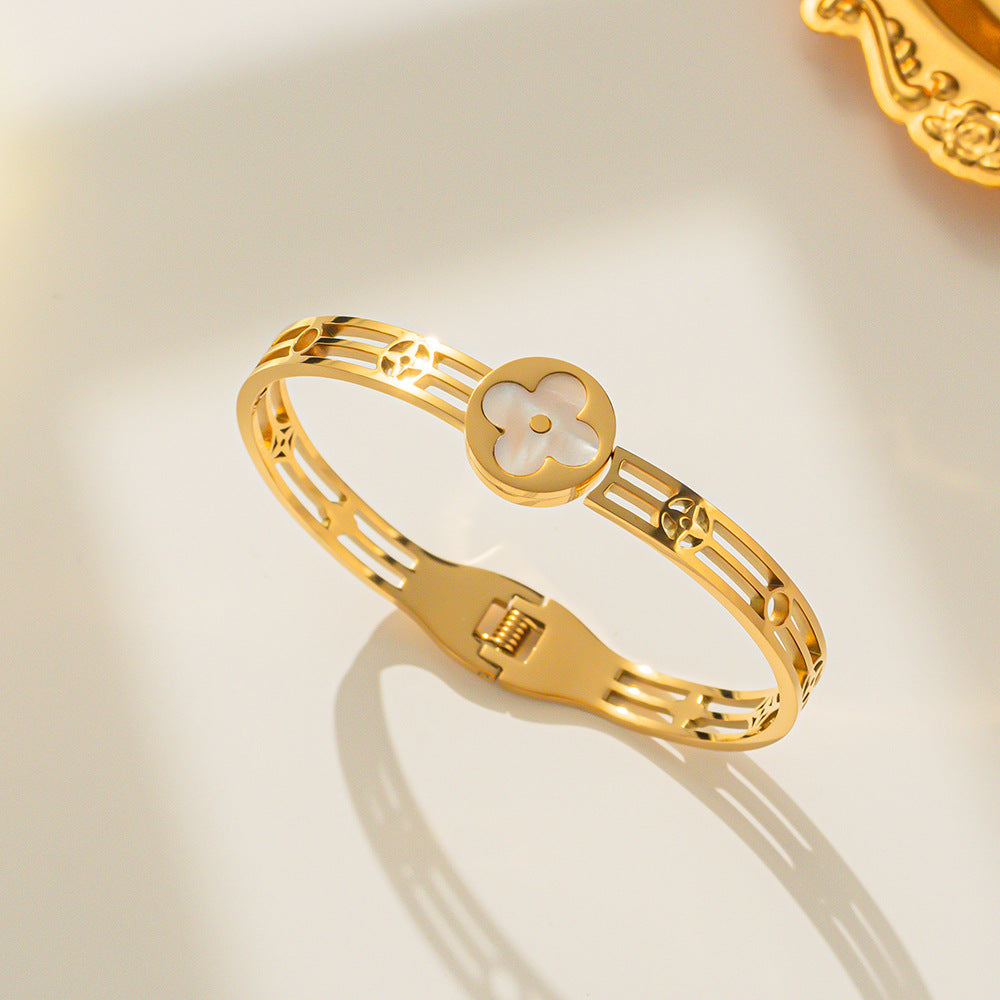 Gold Bracelet with White Flower Charm