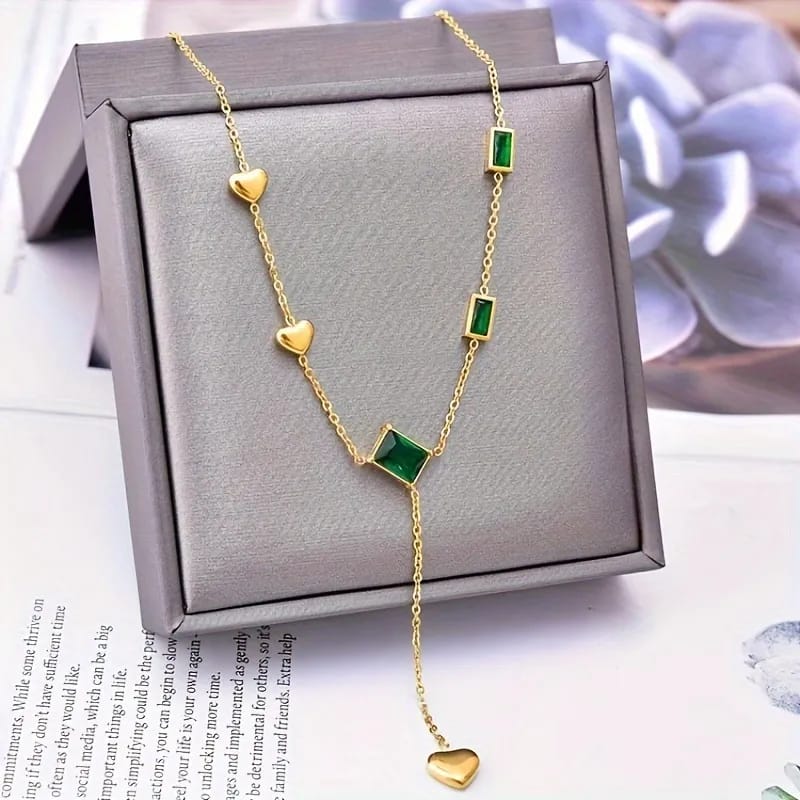 Gold Necklace with Green Gemstones and Heart Accents