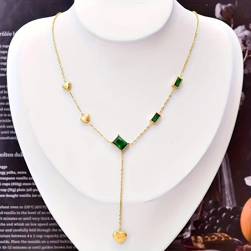 Gold Necklace with Green Gemstones and Heart Accents