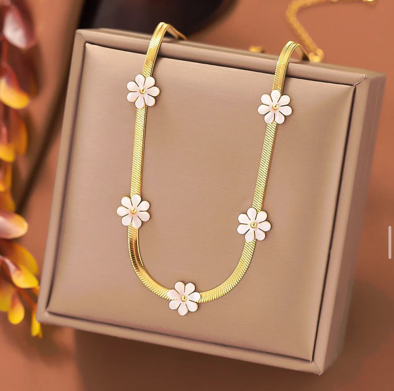 Gold Necklace with White Floral Accents