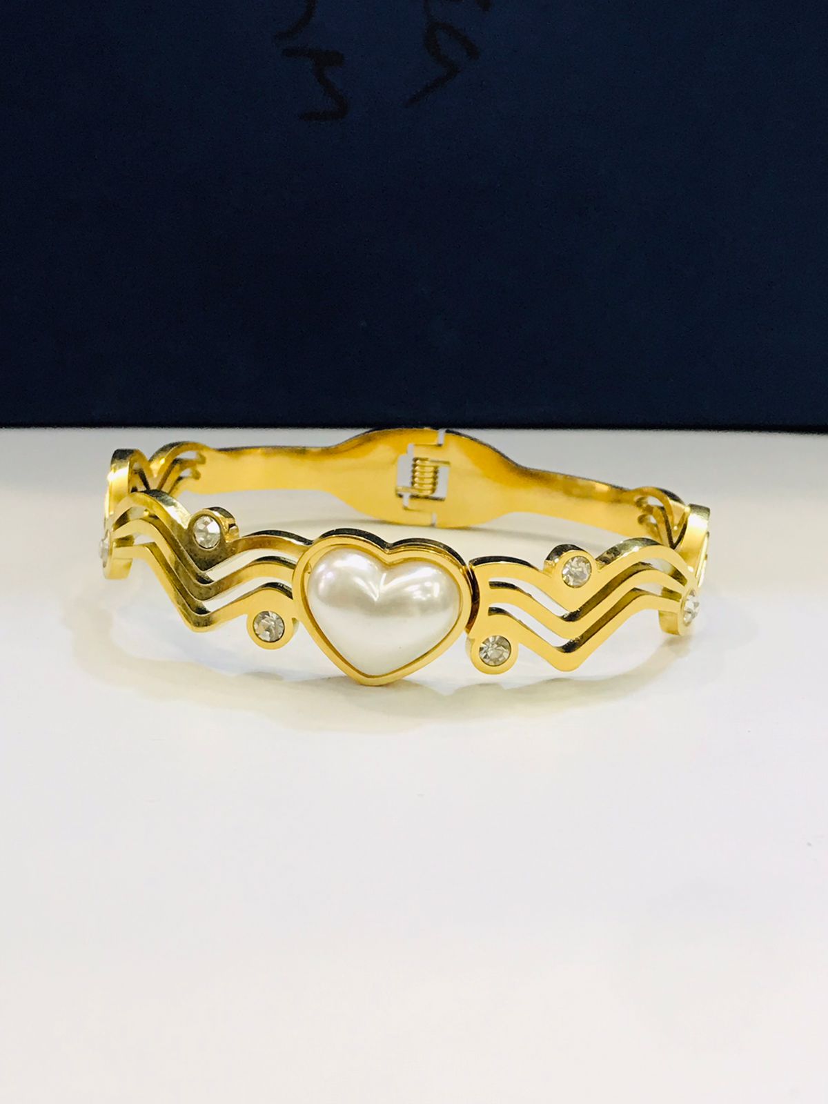 Gold-Tone Wave Pattern Bracelet with Heart Centerpiece