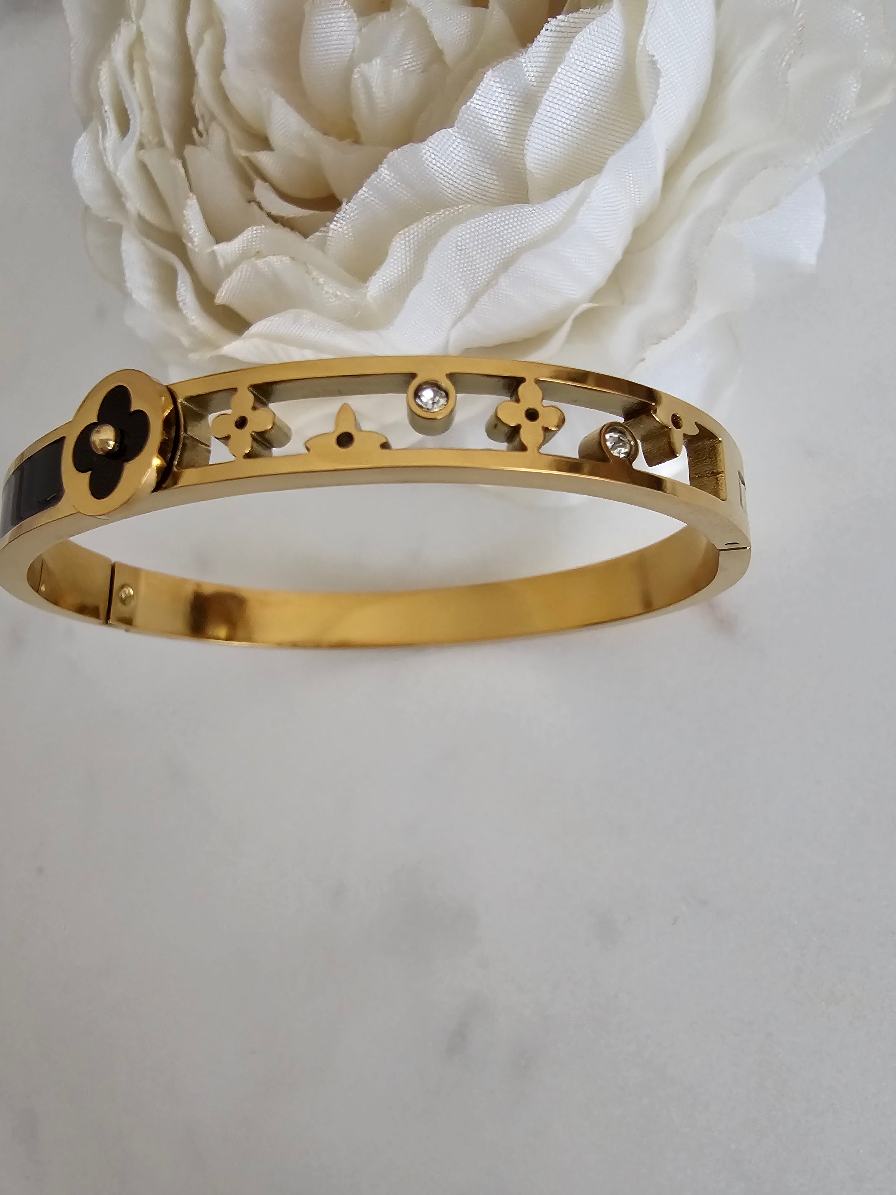 Elegant Gold-Tone Bangle with Black Enamel Detailing