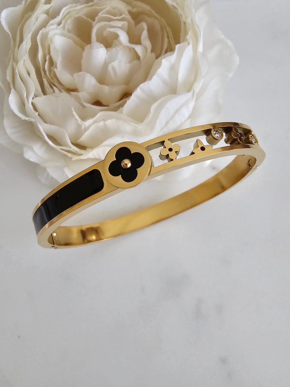 Elegant Gold-Tone Bangle with Black Enamel Detailing