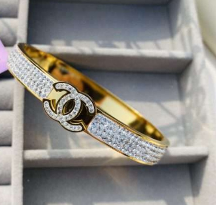 Chanel-Inspired Gold Handcuff Bracelet with Crystal Emblem