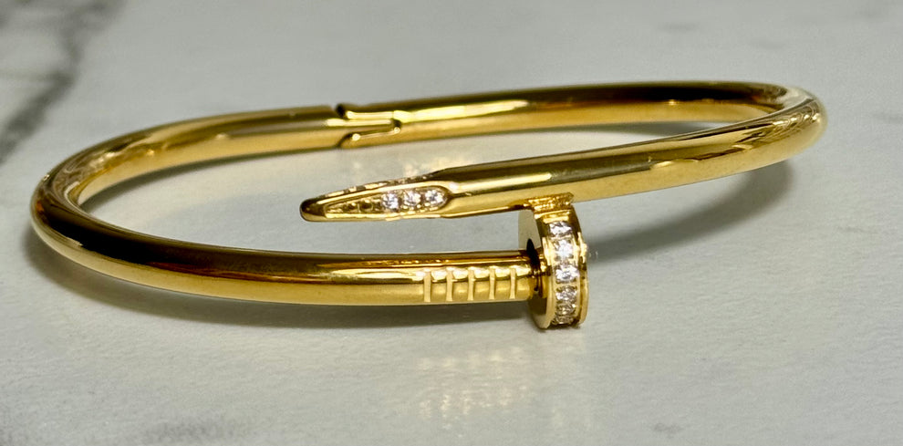 Elegant Gold-Tone Nail Bangle with Stone Embellishment