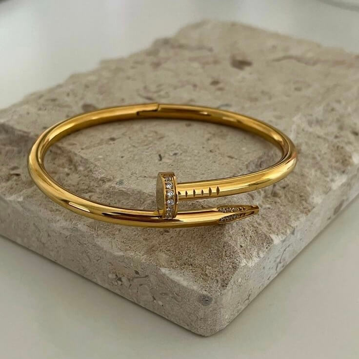 Elegant Gold-Tone Nail Bangle with Stone Embellishment