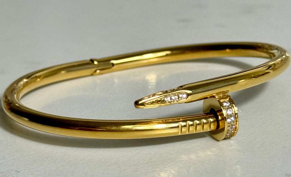 Elegant Gold-Tone Nail Bangle with Stone Embellishment