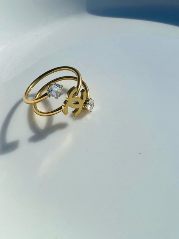  Elegant Gold Chanel Logo Ring with Gemstones