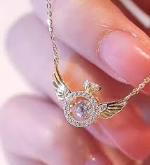 Elegance in Motion: Rosegold Rotating Crystal Necklace