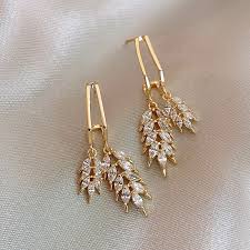 Gilded Foliage: Crystal Leaf Shaped Golden Earrings
