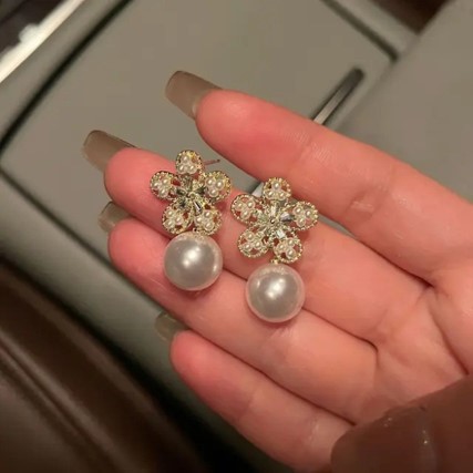 Artisanal Bloom: Alloy Fashion Golden Flower Handcrafted Earrings