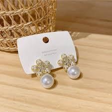 Artisanal Bloom: Alloy Fashion Golden Flower Handcrafted Earrings