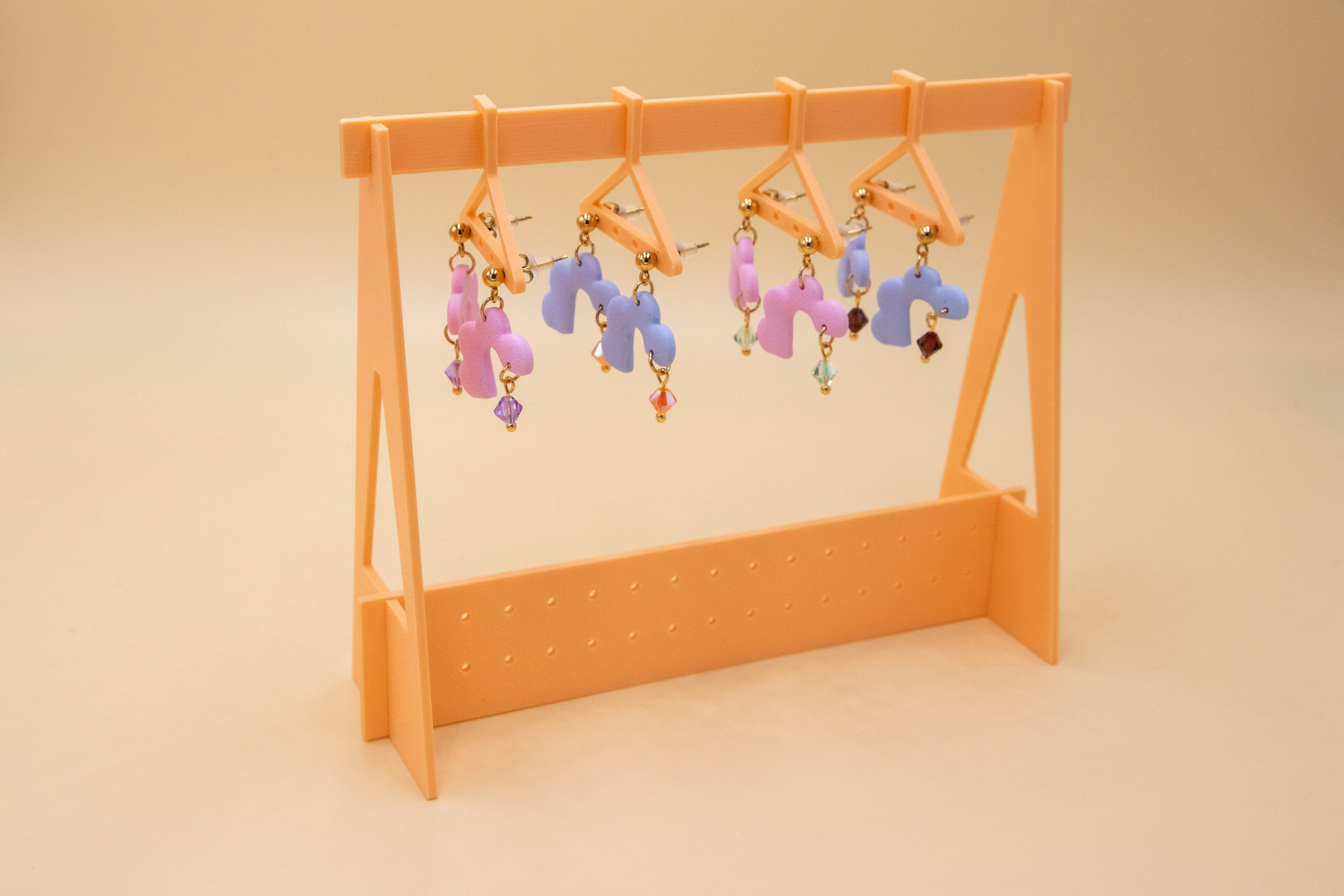 Portant pour boucles d'oreilles, avec cintres