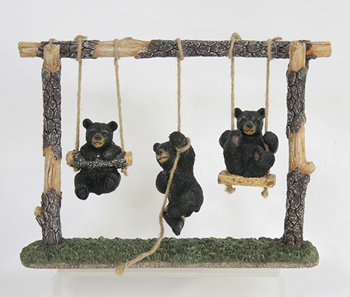 Playful Bears on a Swing Set