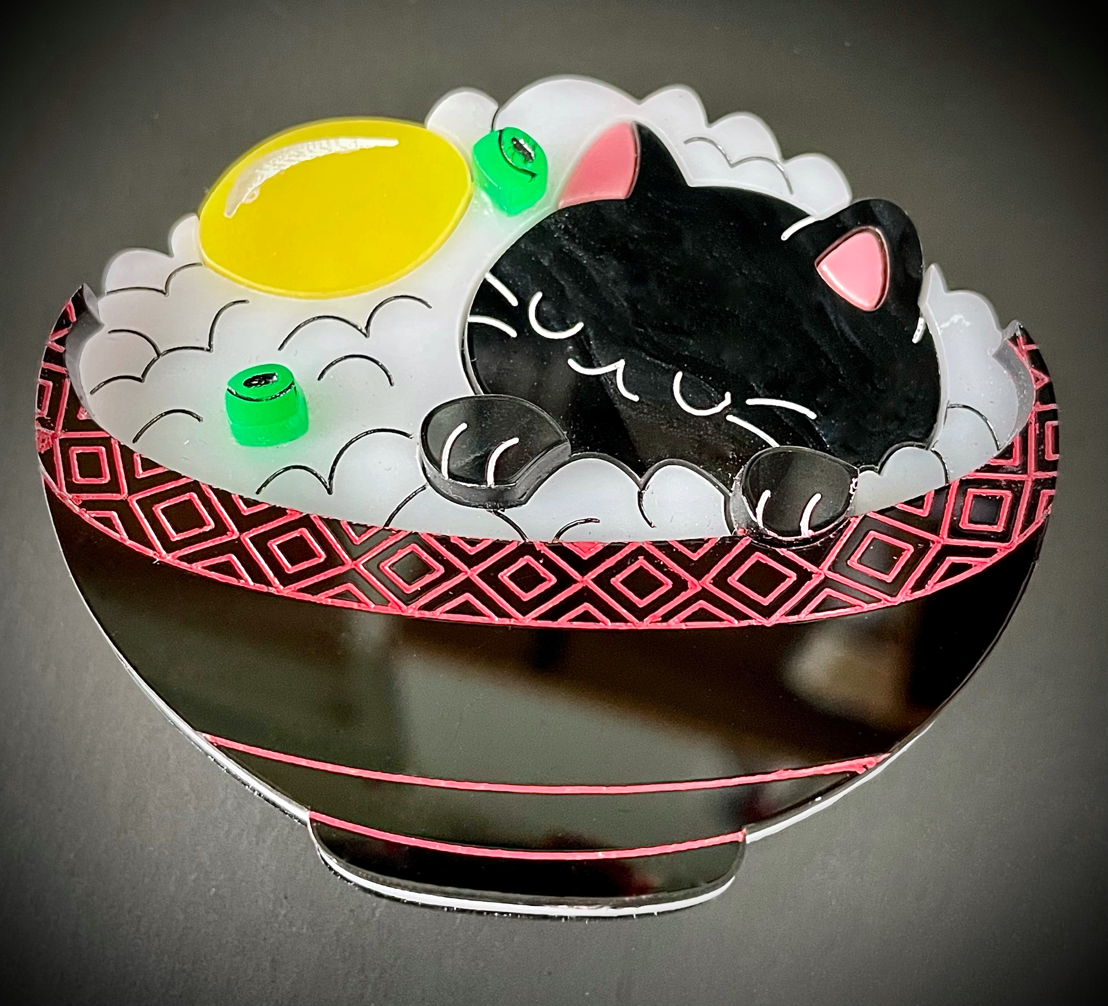 Chat noir bol de riz