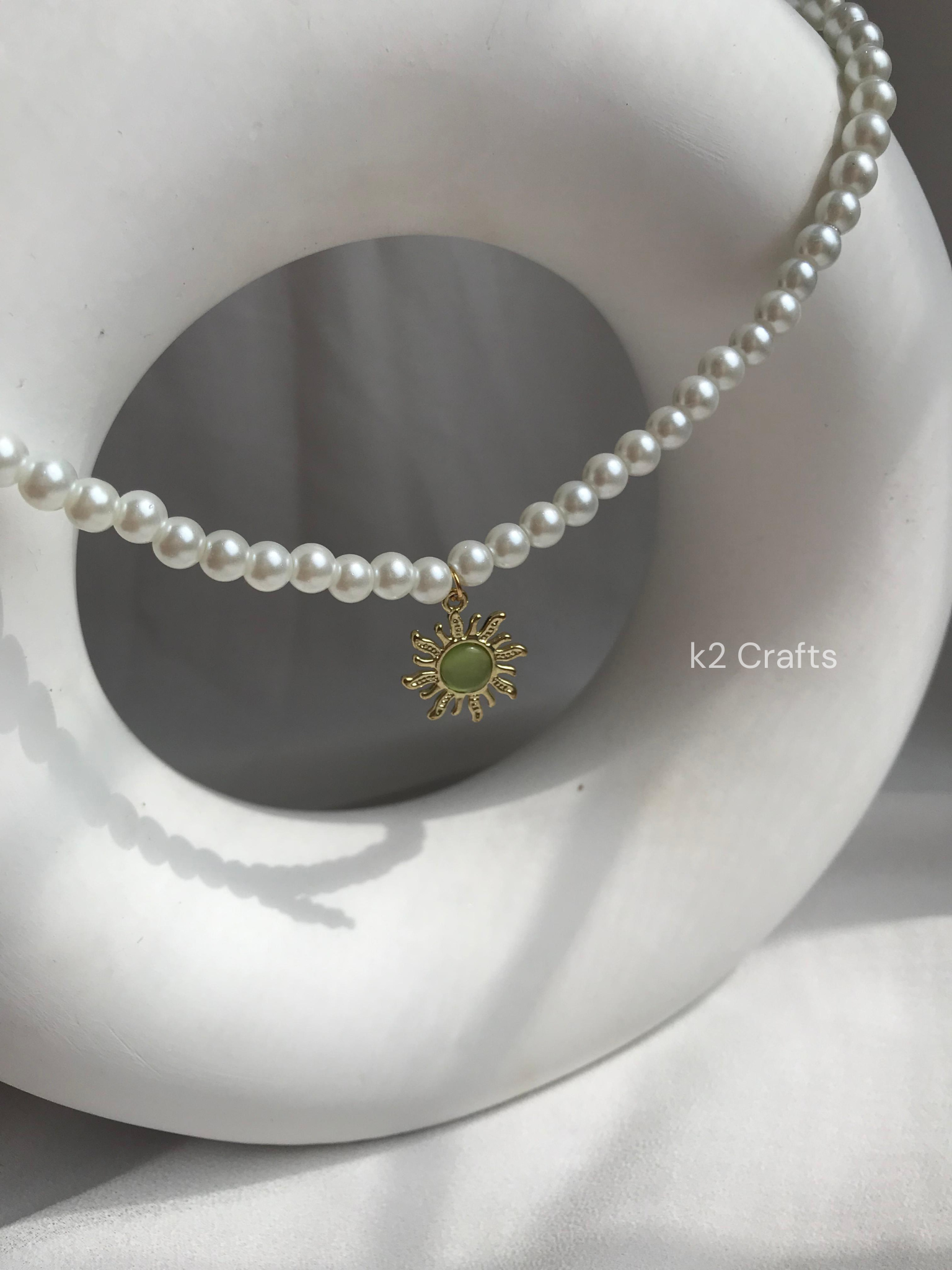 Pearl necklace with sunshine pendent