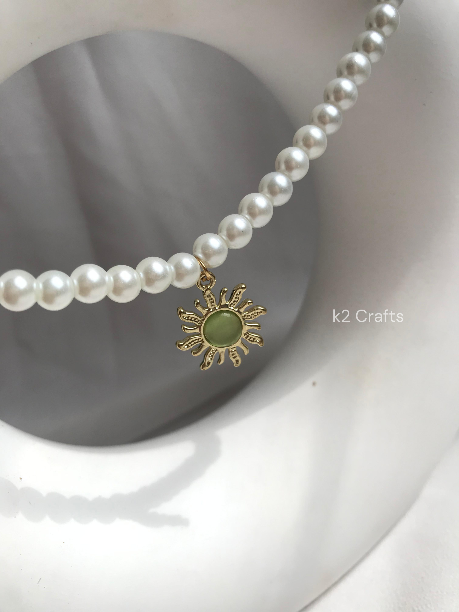 Pearl necklace with sunshine pendent