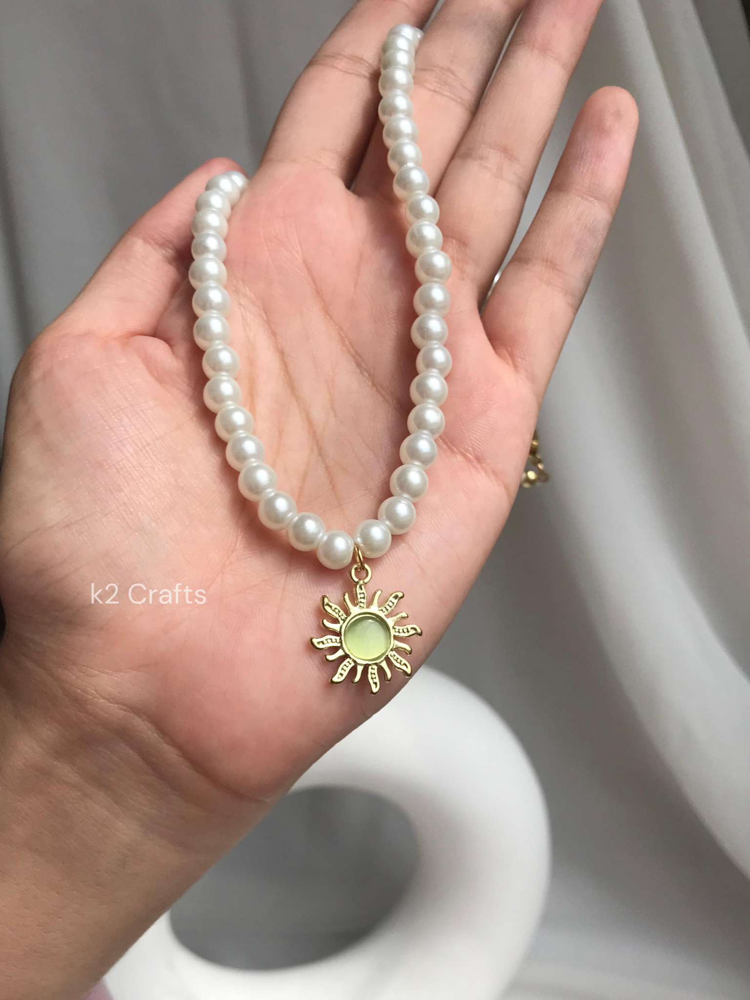 Pearl necklace with sunshine pendent