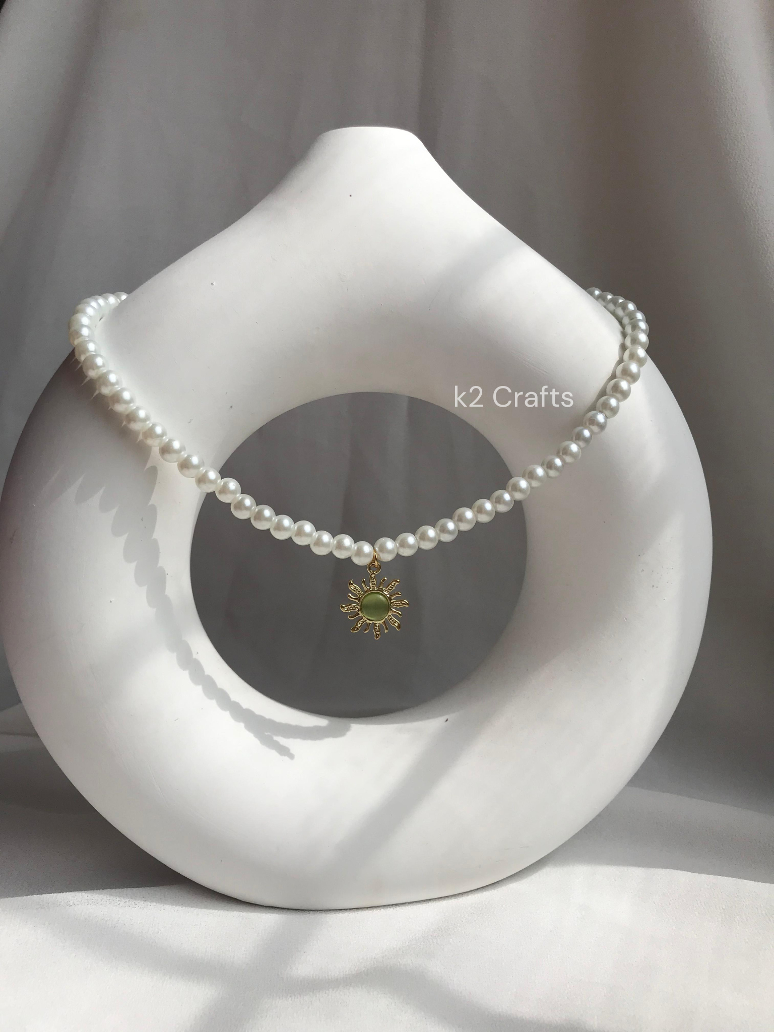 Pearl necklace with sunshine pendent