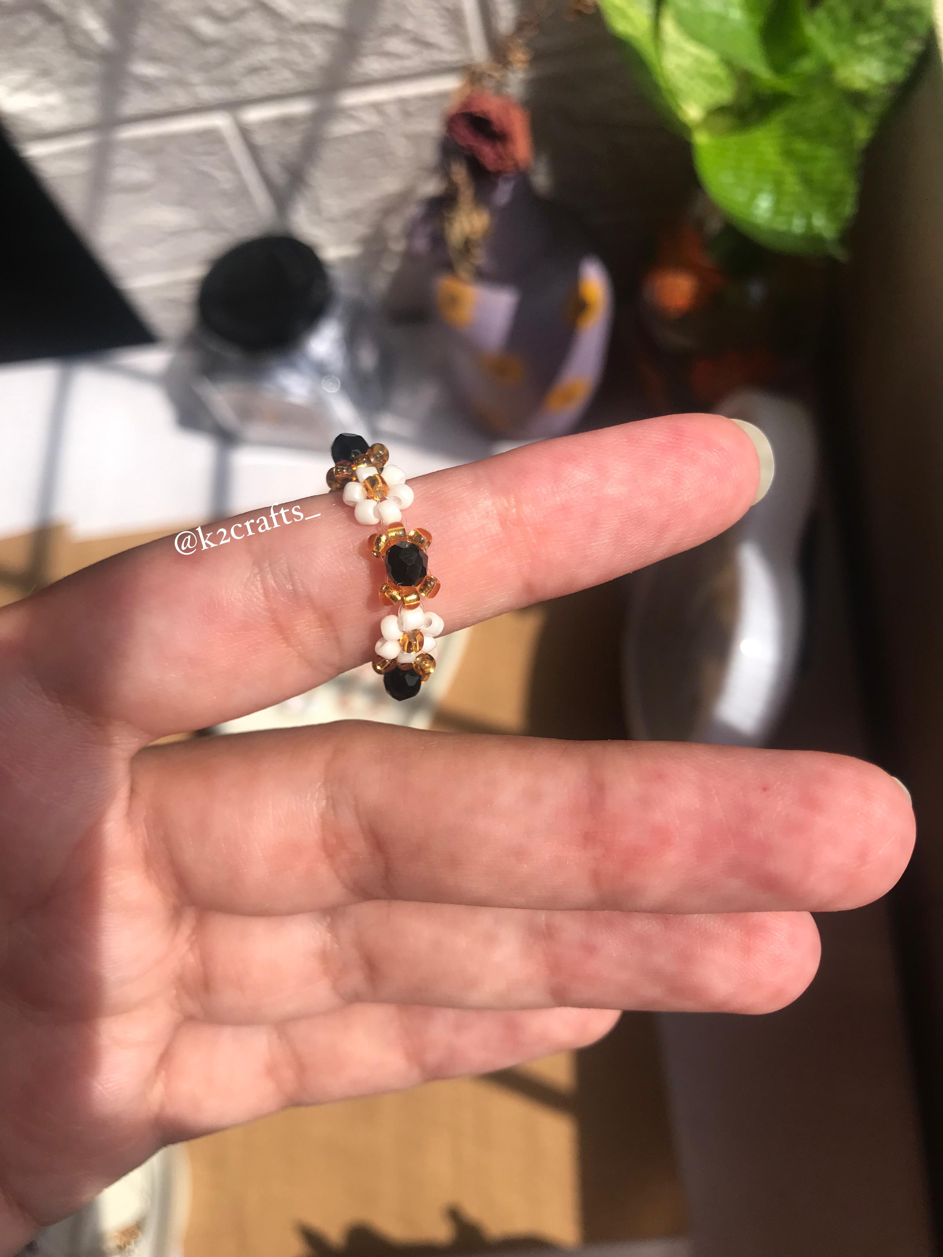 White daisy with crystal bead ring