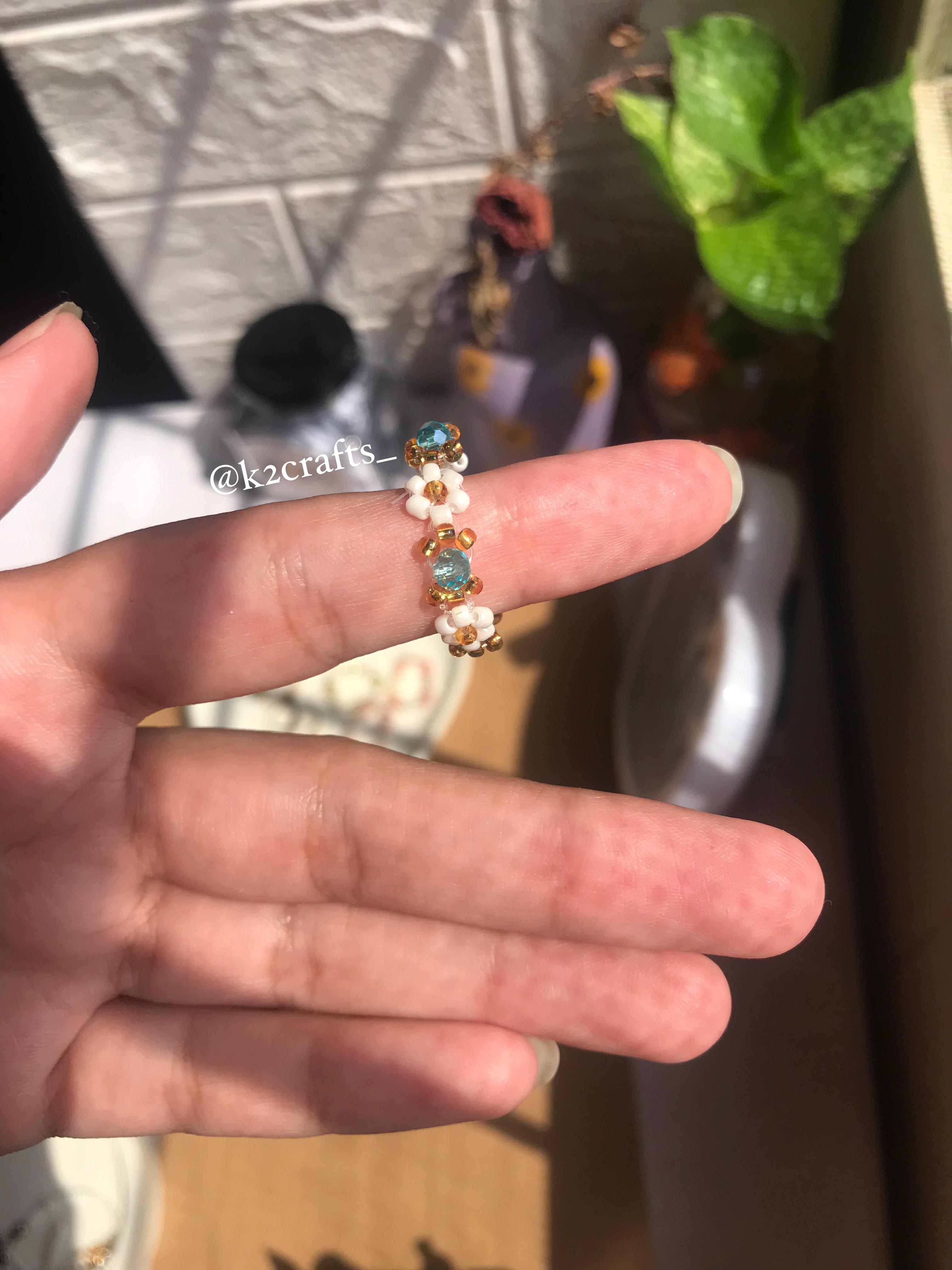 White daisy with crystal bead ring