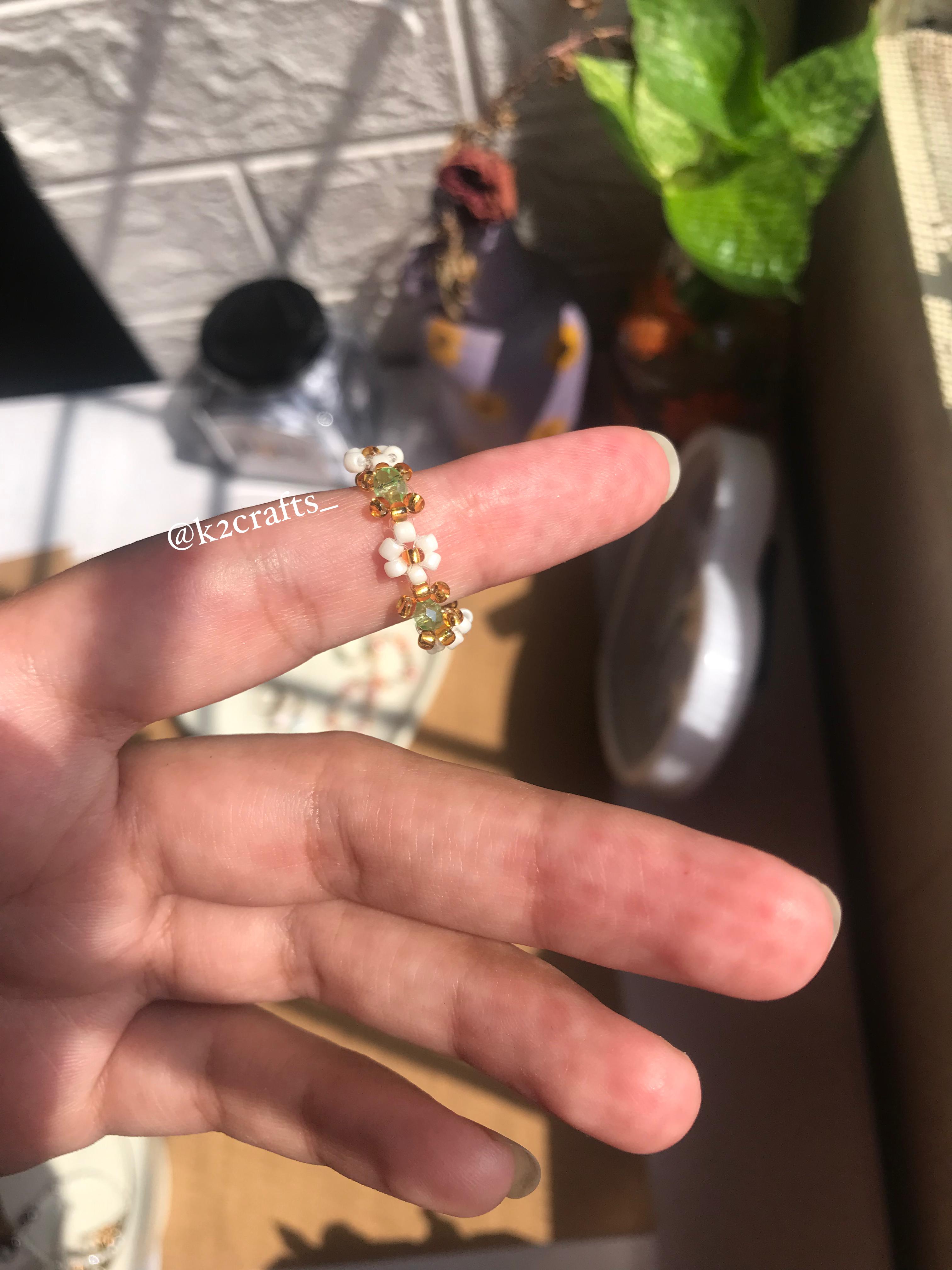 White daisy with crystal bead ring