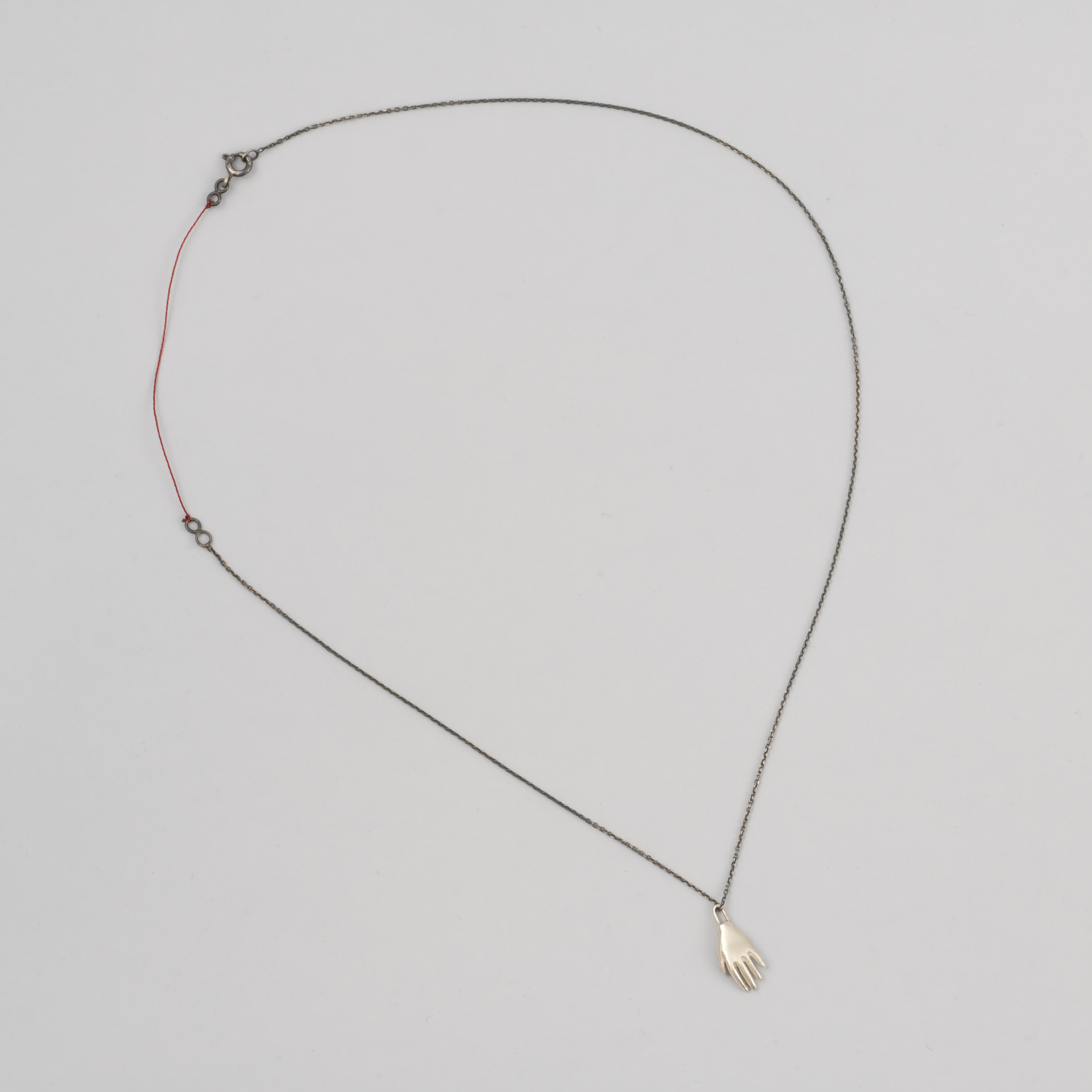 Colgante mano de plata