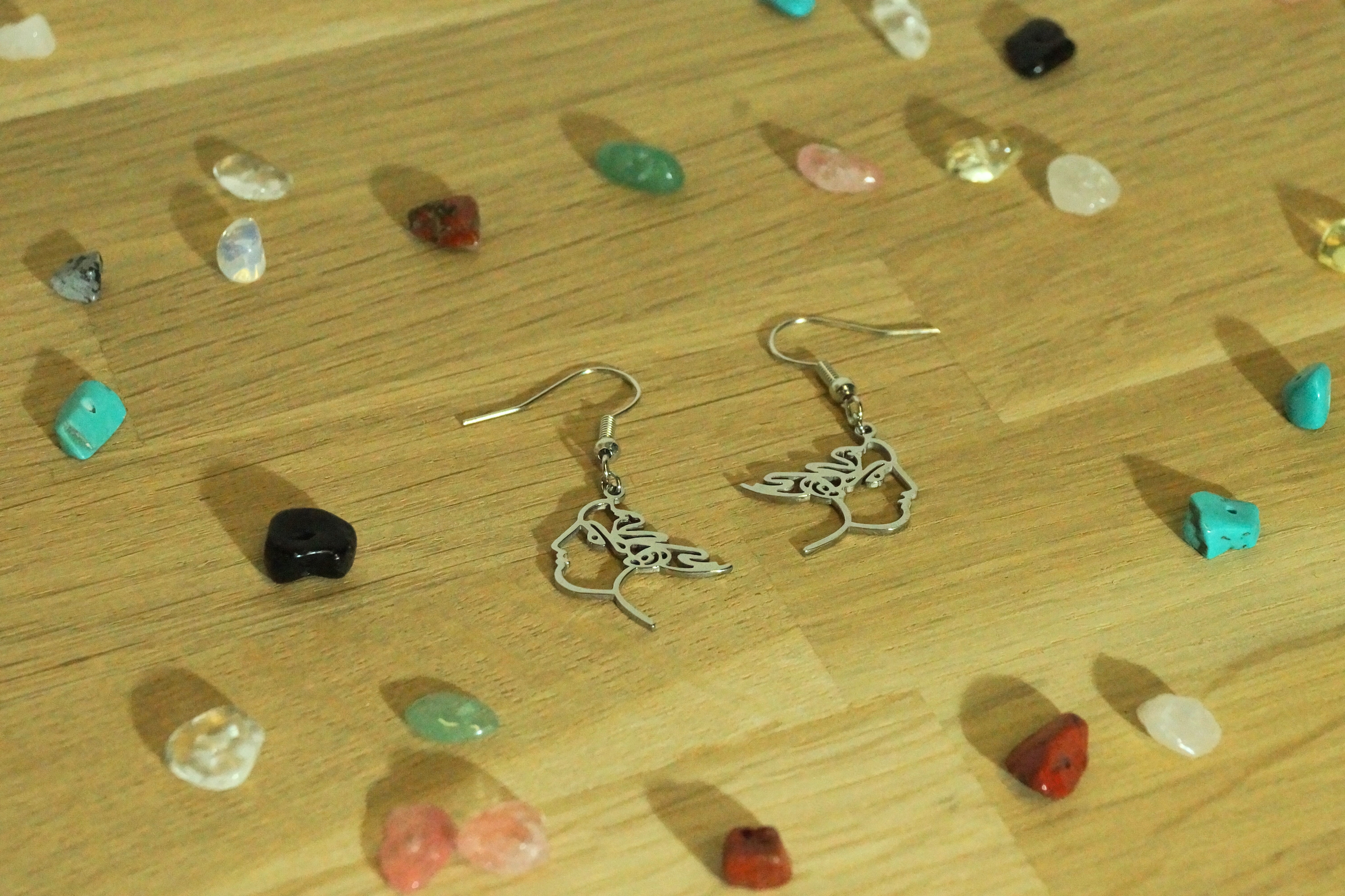 Boucles d'oreilles visage minimaliste
