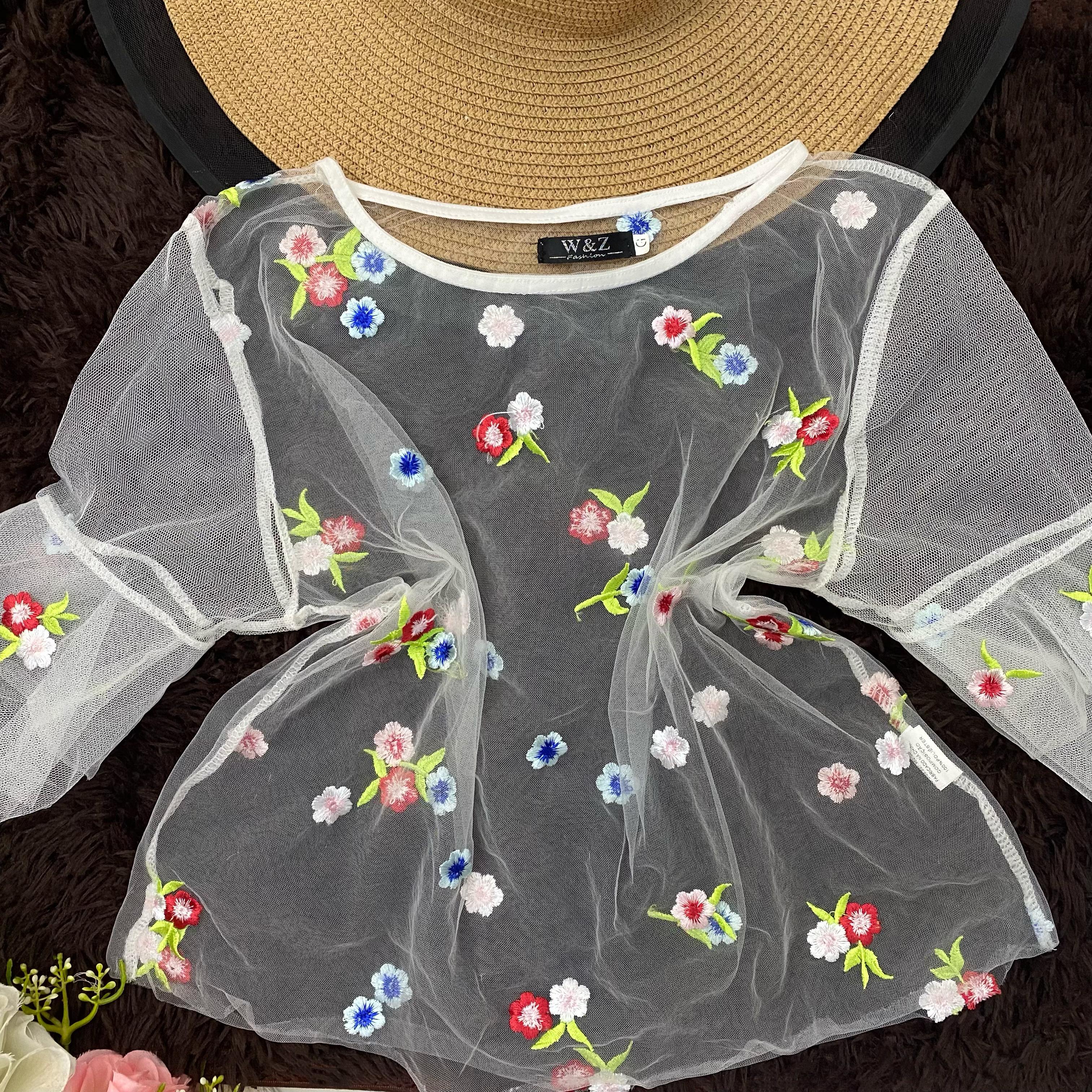 Blusa transparente com flores Tamanho G