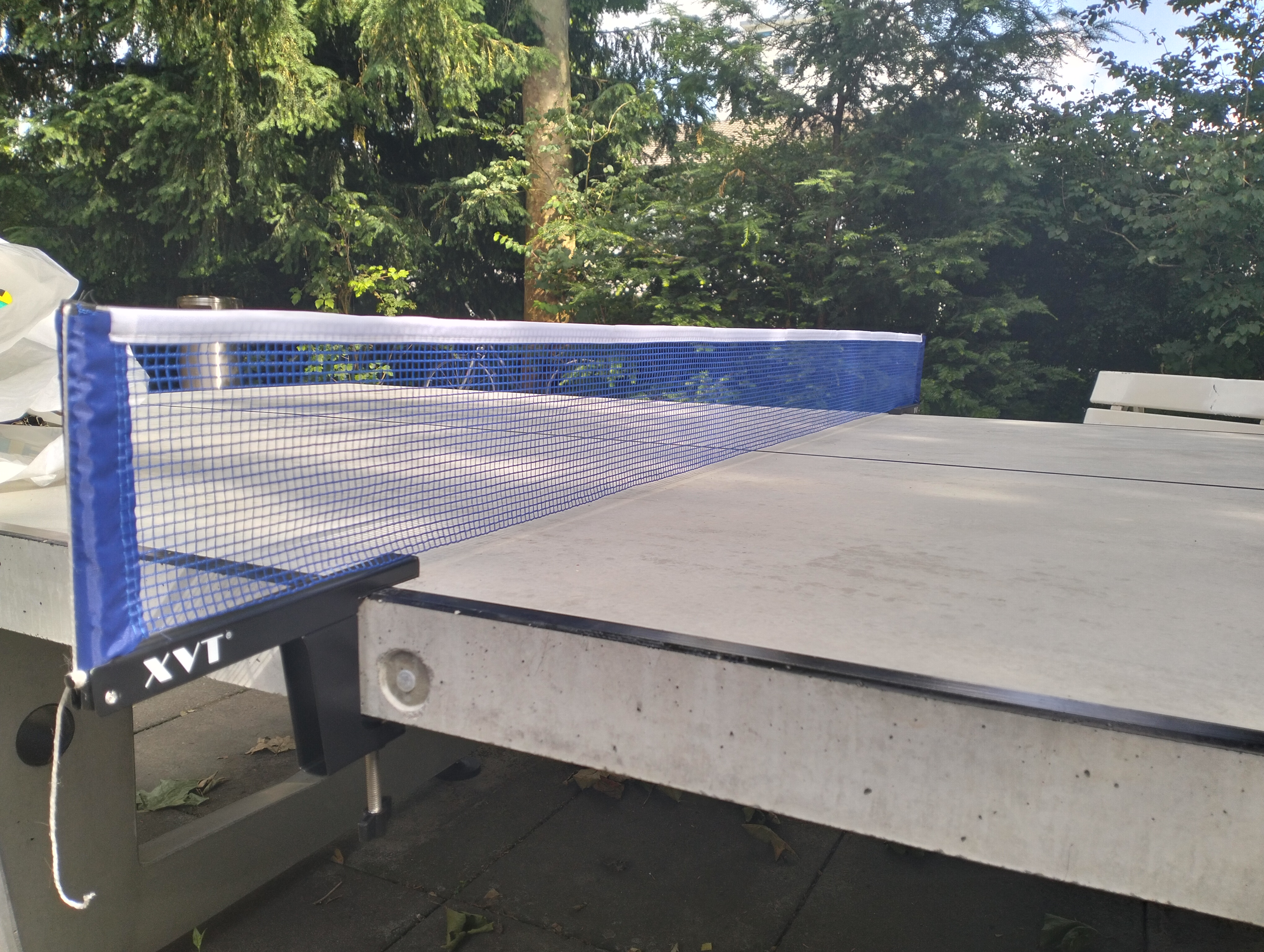 Table tennis net for thick tables