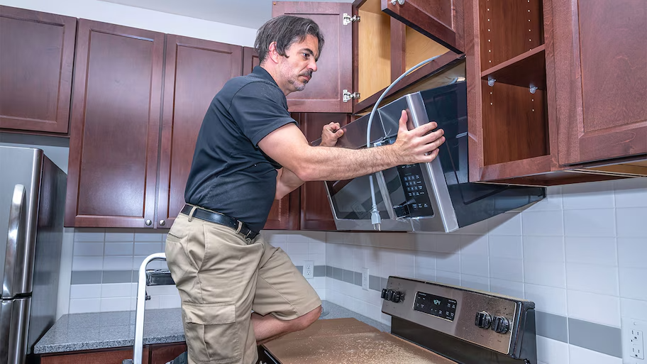 Over the range microwave installation