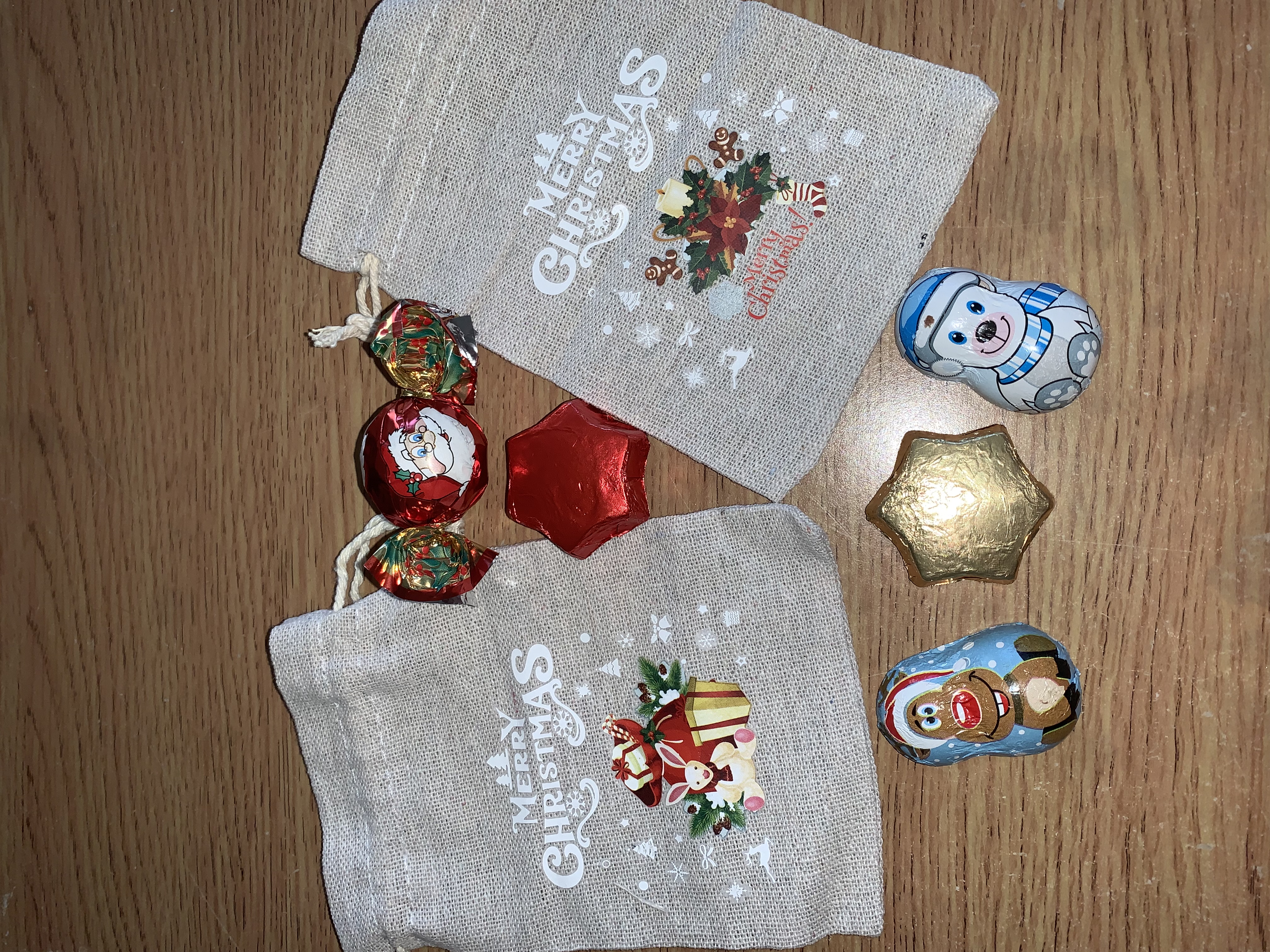 Cute little Christmas hesian bags complete with either festive chocolates or a small festive sweet bag