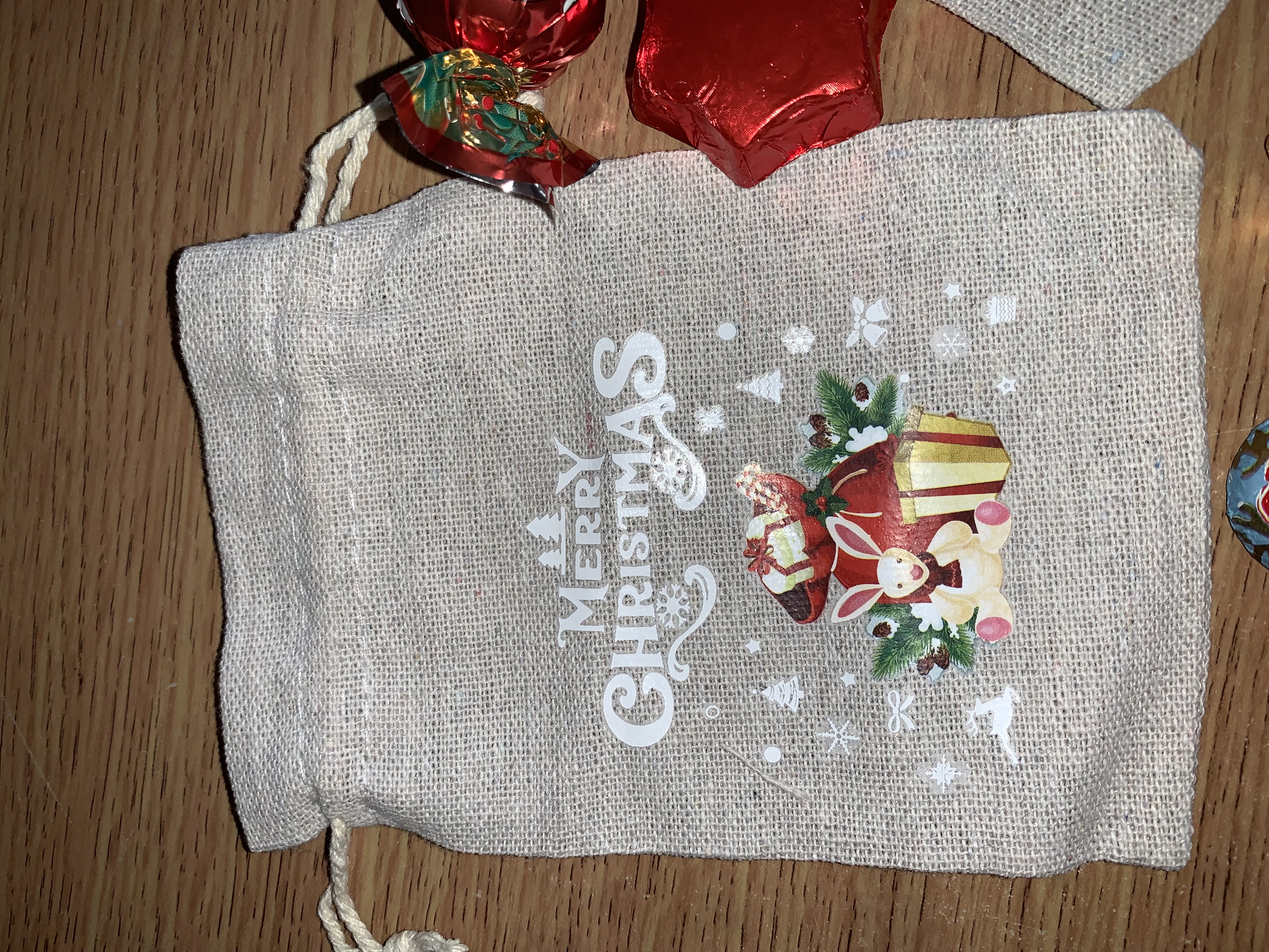 Cute little Christmas hesian bags complete with either festive chocolates or a small festive sweet bag