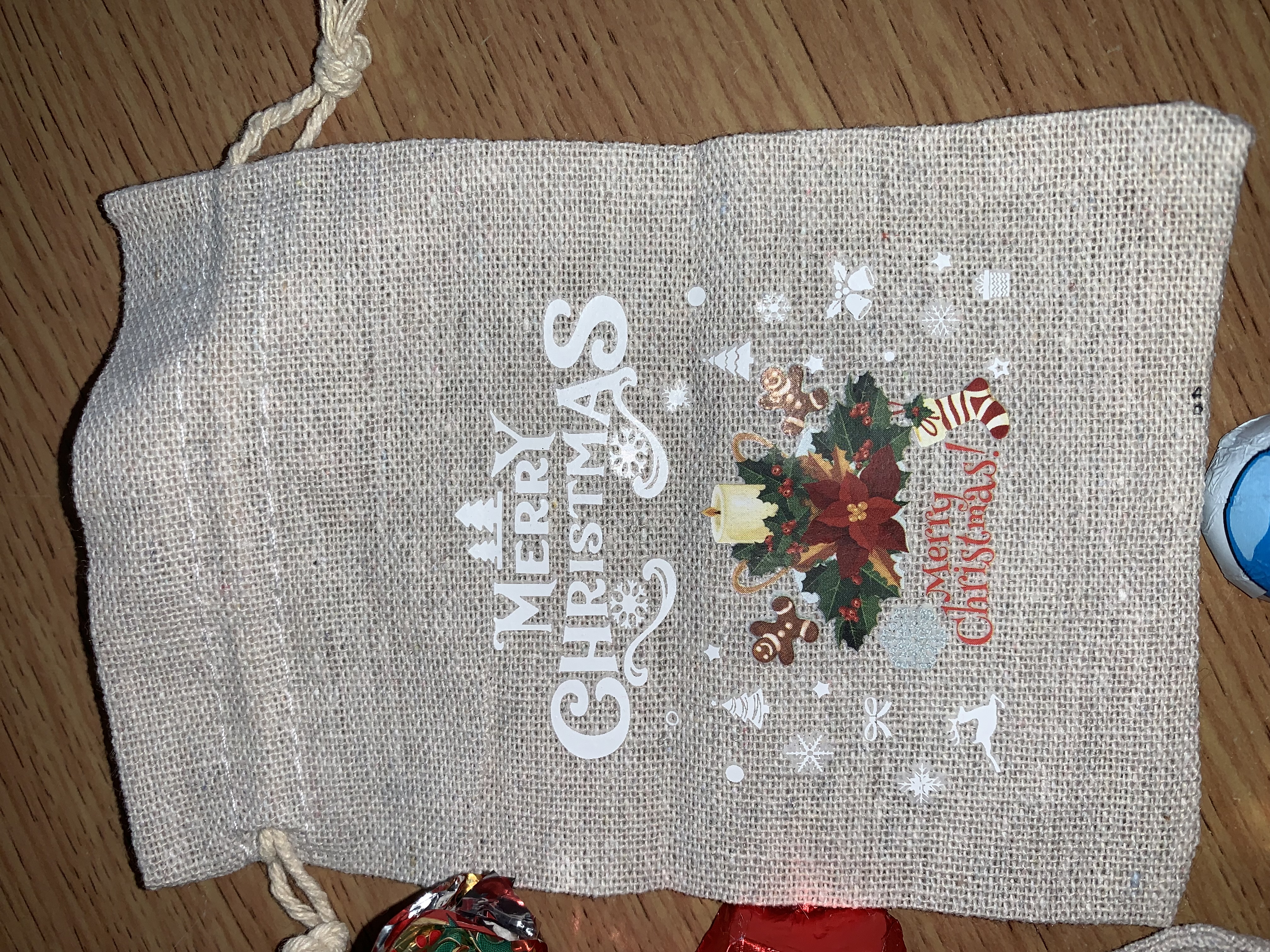 Cute little Christmas hesian bags complete with either festive chocolates or a small festive sweet bag