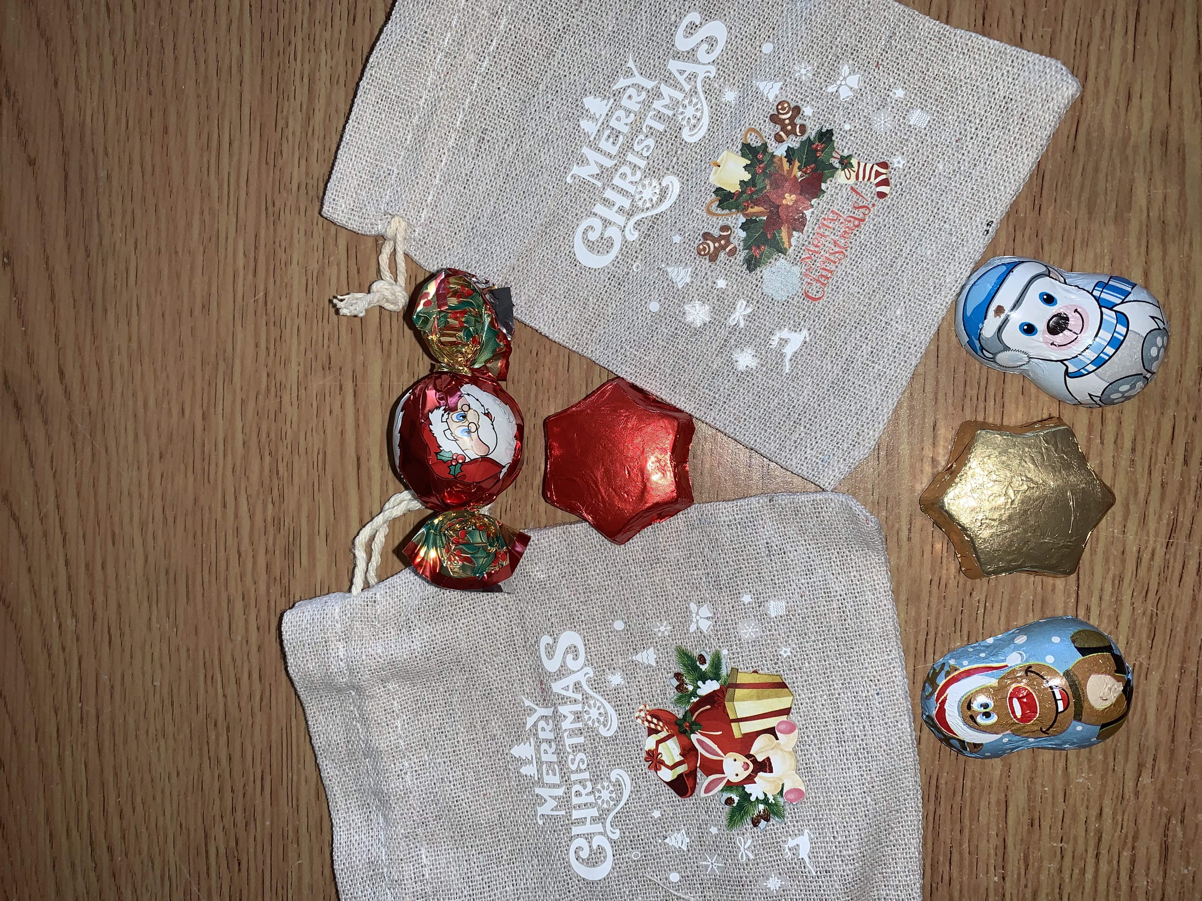 Cute little Christmas hesian bags complete with either festive chocolates or a small festive sweet bag