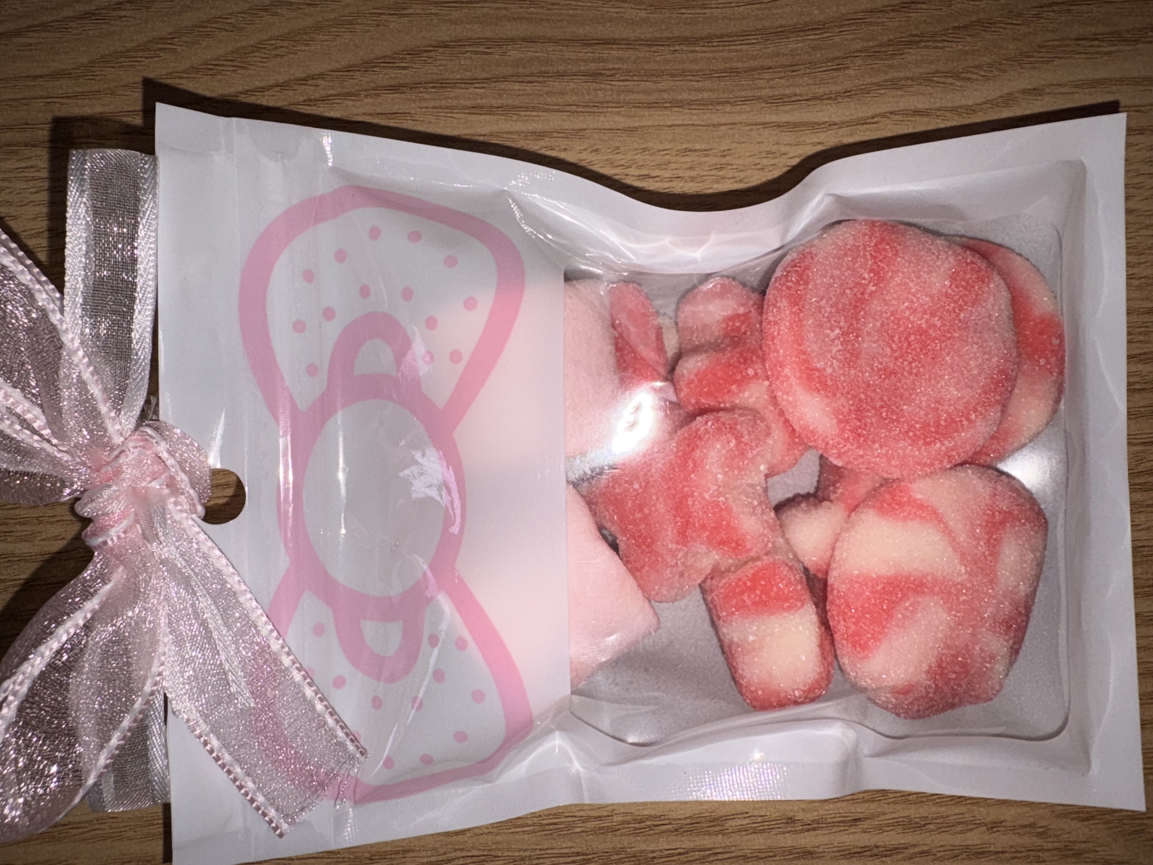 White sweet pouch with large pink bow to the top finished with two tone organza ribbon