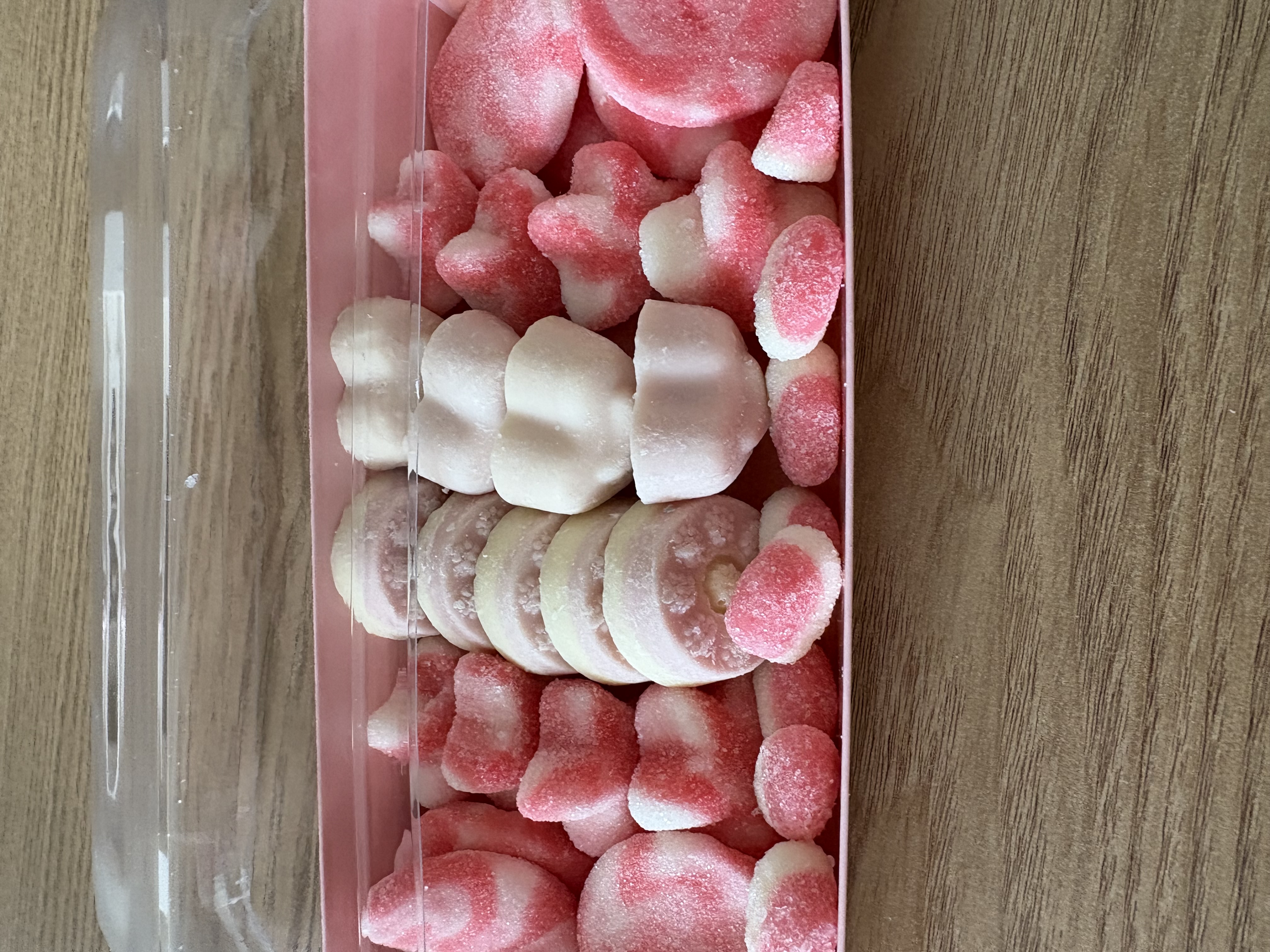 Pink rectangular sweet tray complete with sweets
