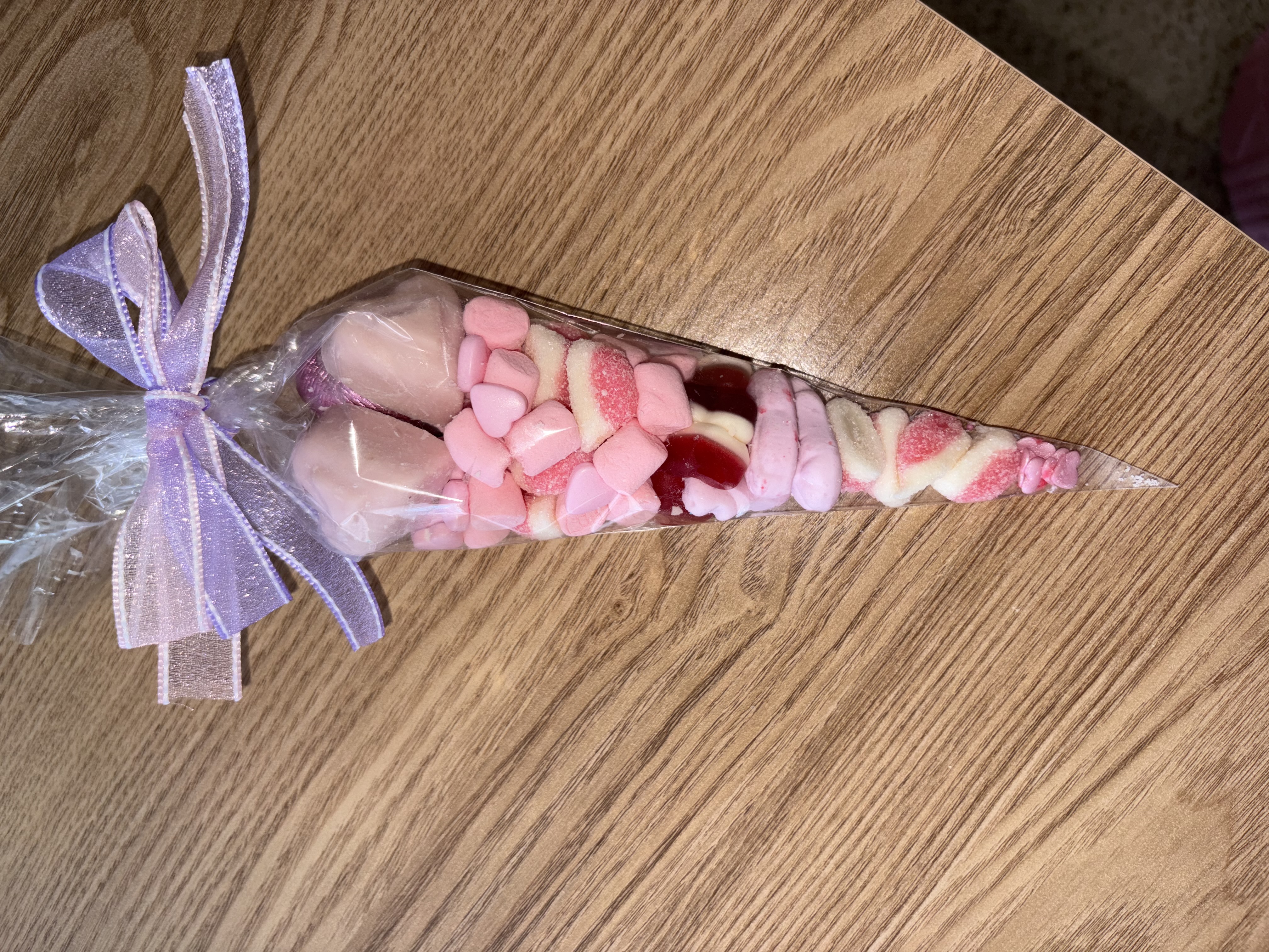 Beautiful pink sweetcone with two tone organzq ribbon to the top 