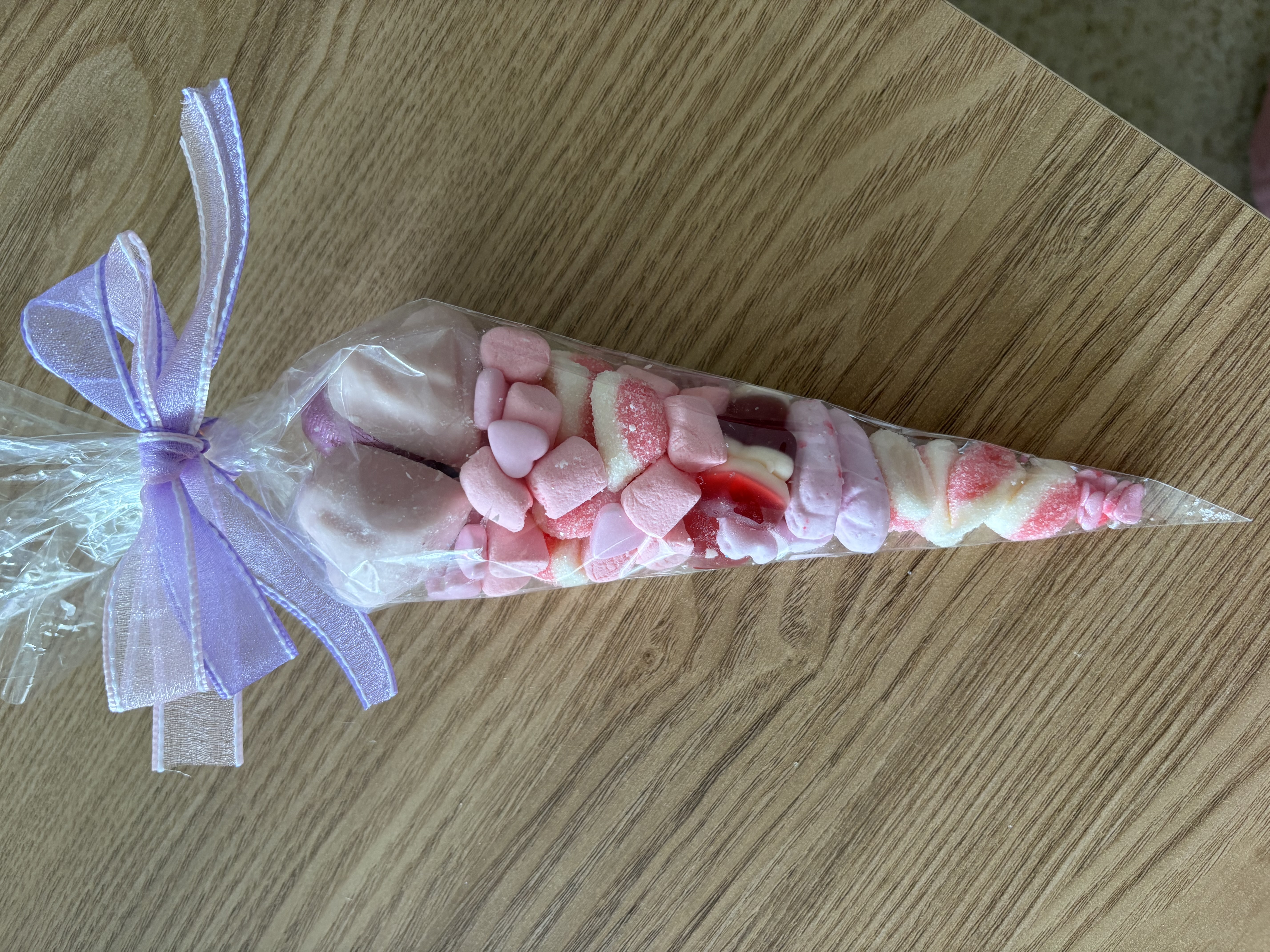 Beautiful pink sweetcone with two tone organzq ribbon to the top 