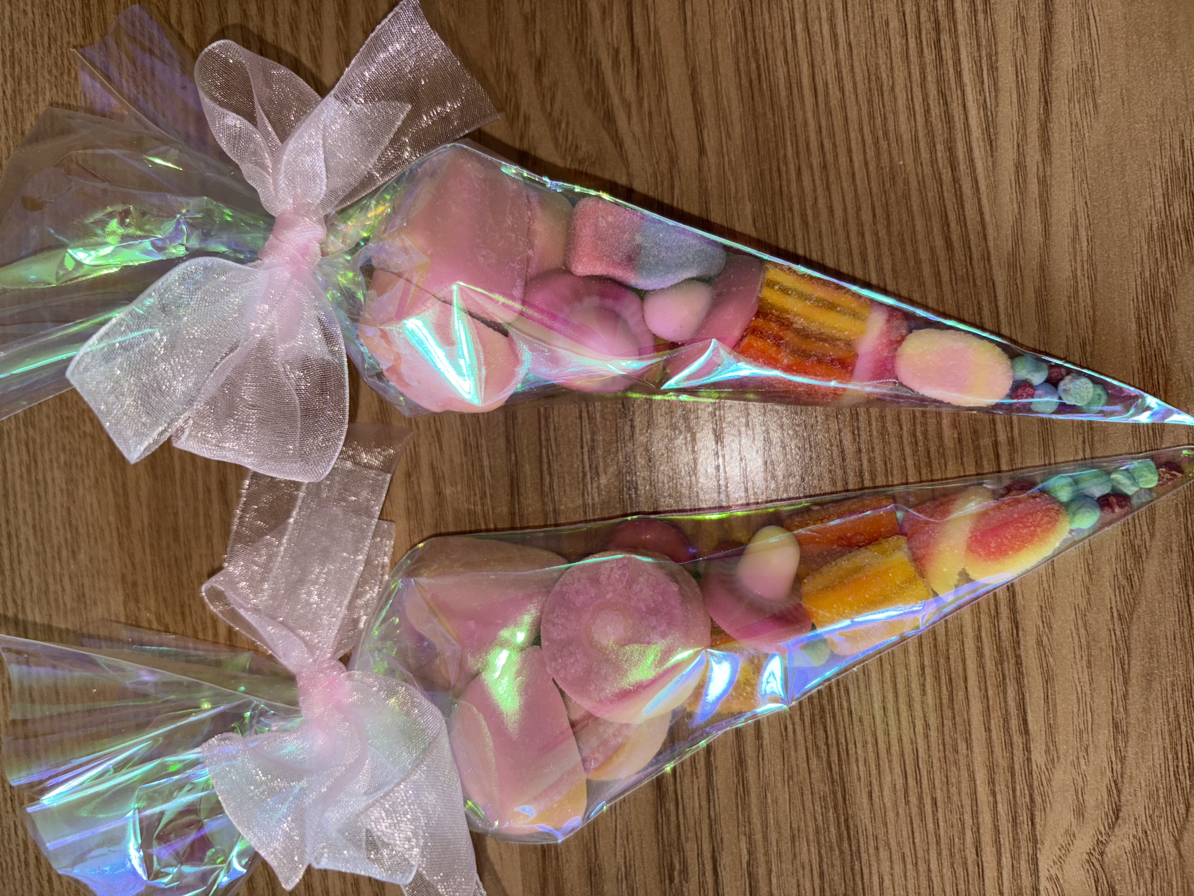 Iredescent sweetcones complete with a variety of tasty sweets and finished with beautiful organza ribbon