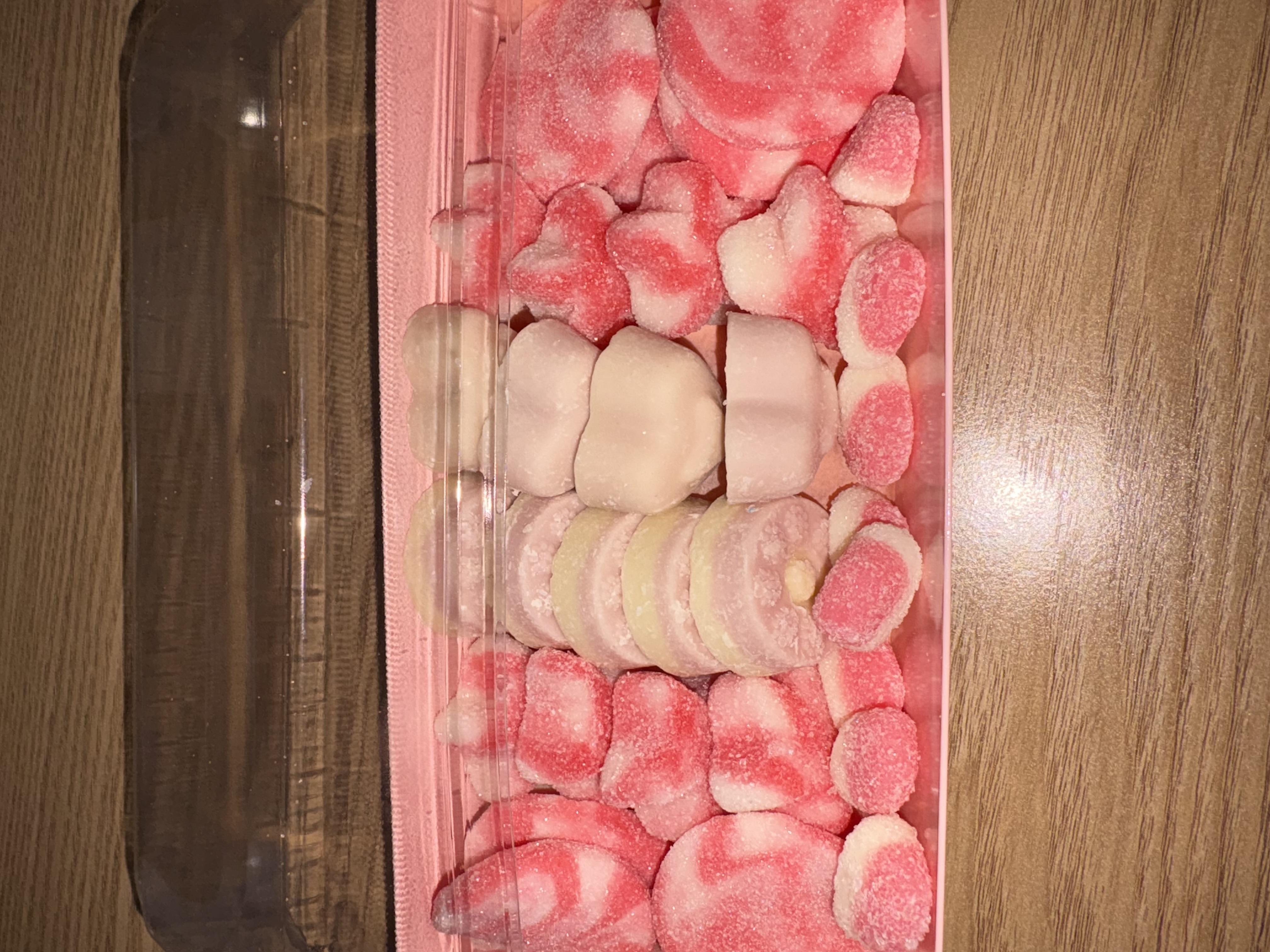Pink rectangular sweet tray complete with sweets