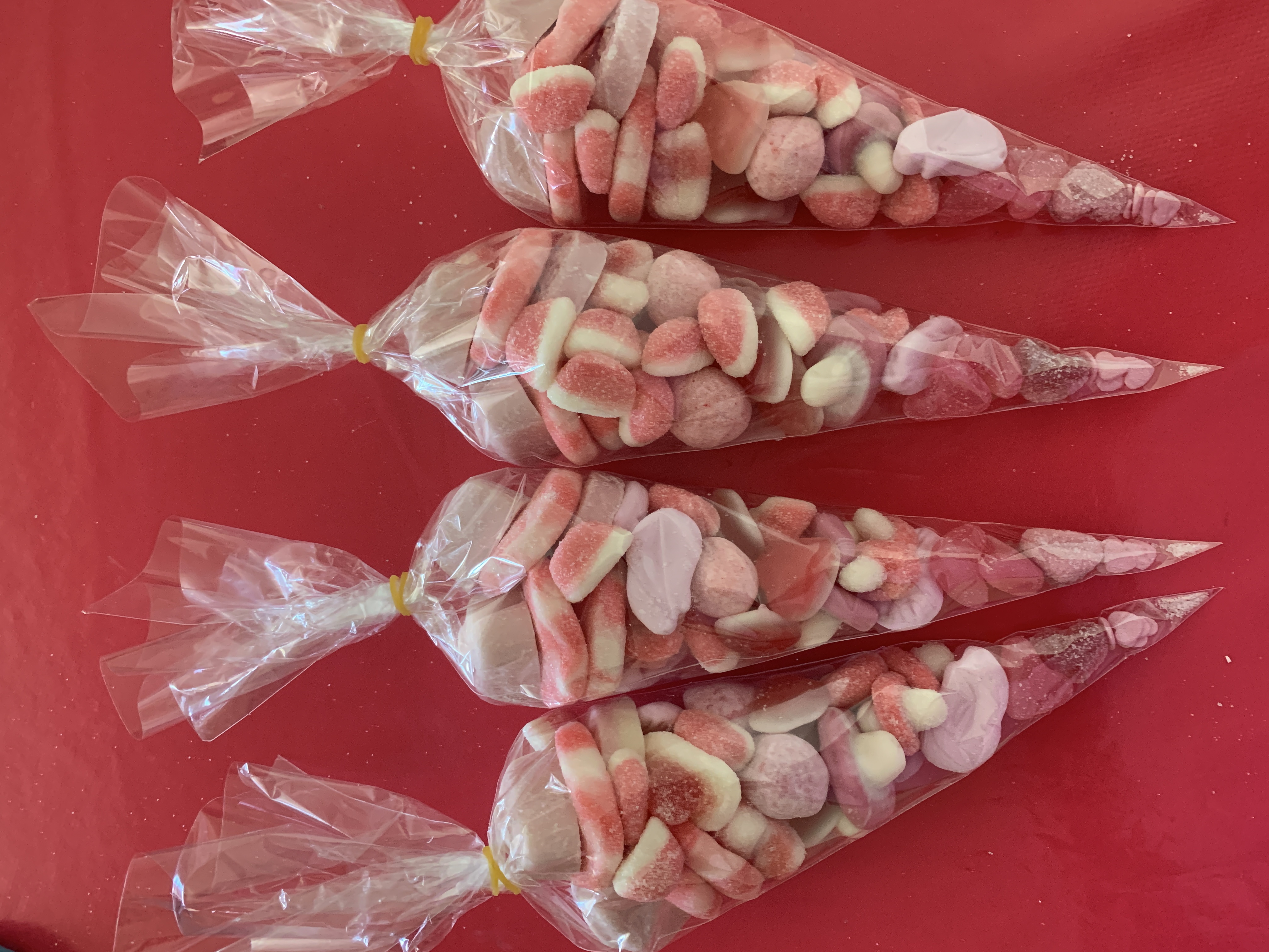 Just pink sweetcones including an assortment of pink sweets 