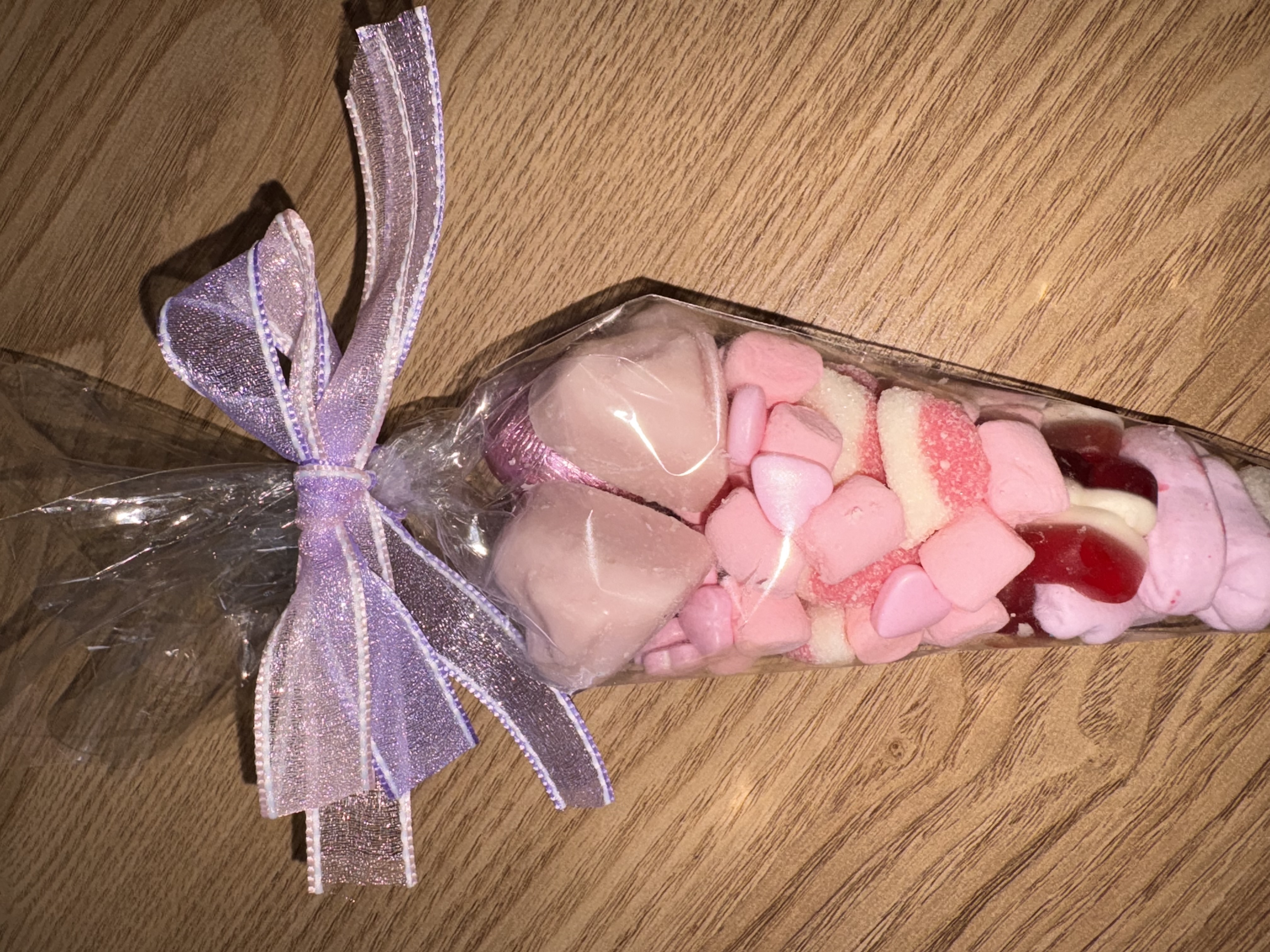 Beautiful pink sweetcone with two tone organzq ribbon to the top 